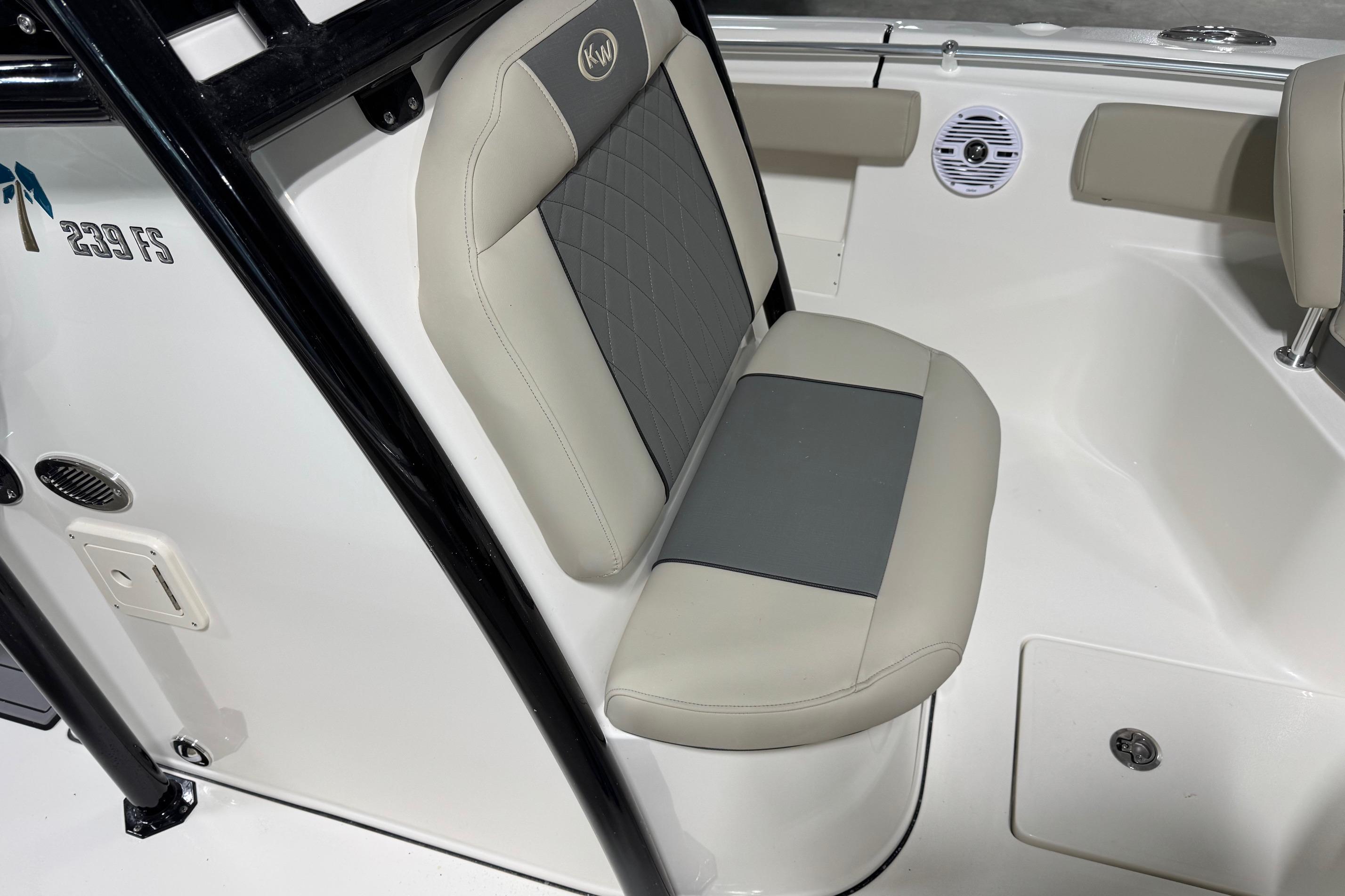 2026 Key West 239 FS boat interior seating with beige and gray upholstery.
