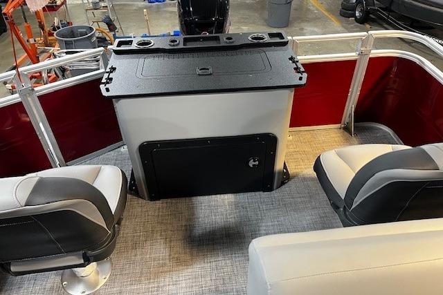 2026 Sun Tracker SportFish 22 DLX interior with seating and storage.