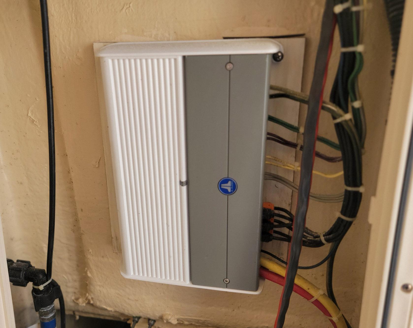 Electrical panel with multiple wires, mounted on a wall, in a 2018 Scout 275 LXF boat.