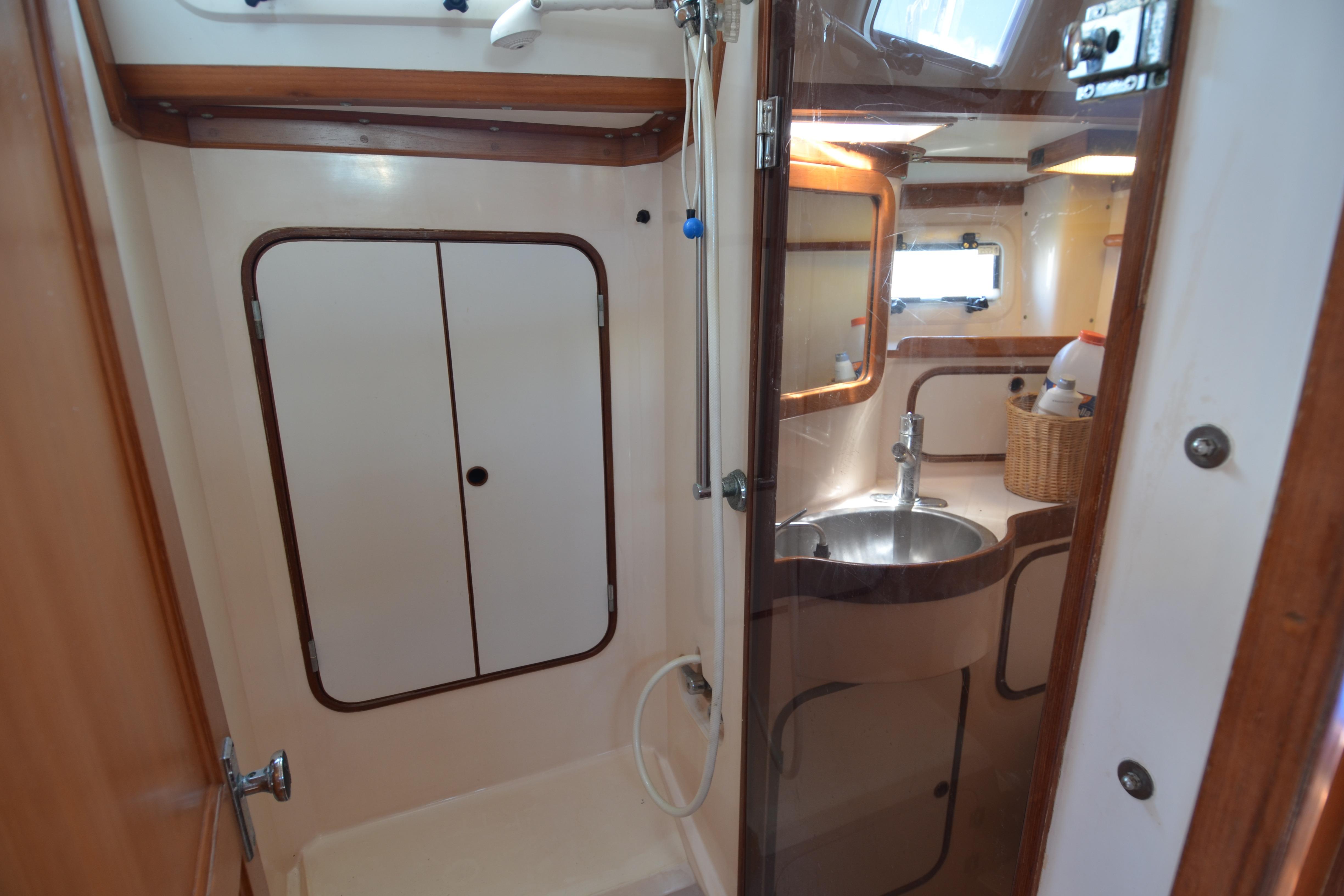 Bathroom interior of 1987 Norseman 400 yacht with shower and sink.