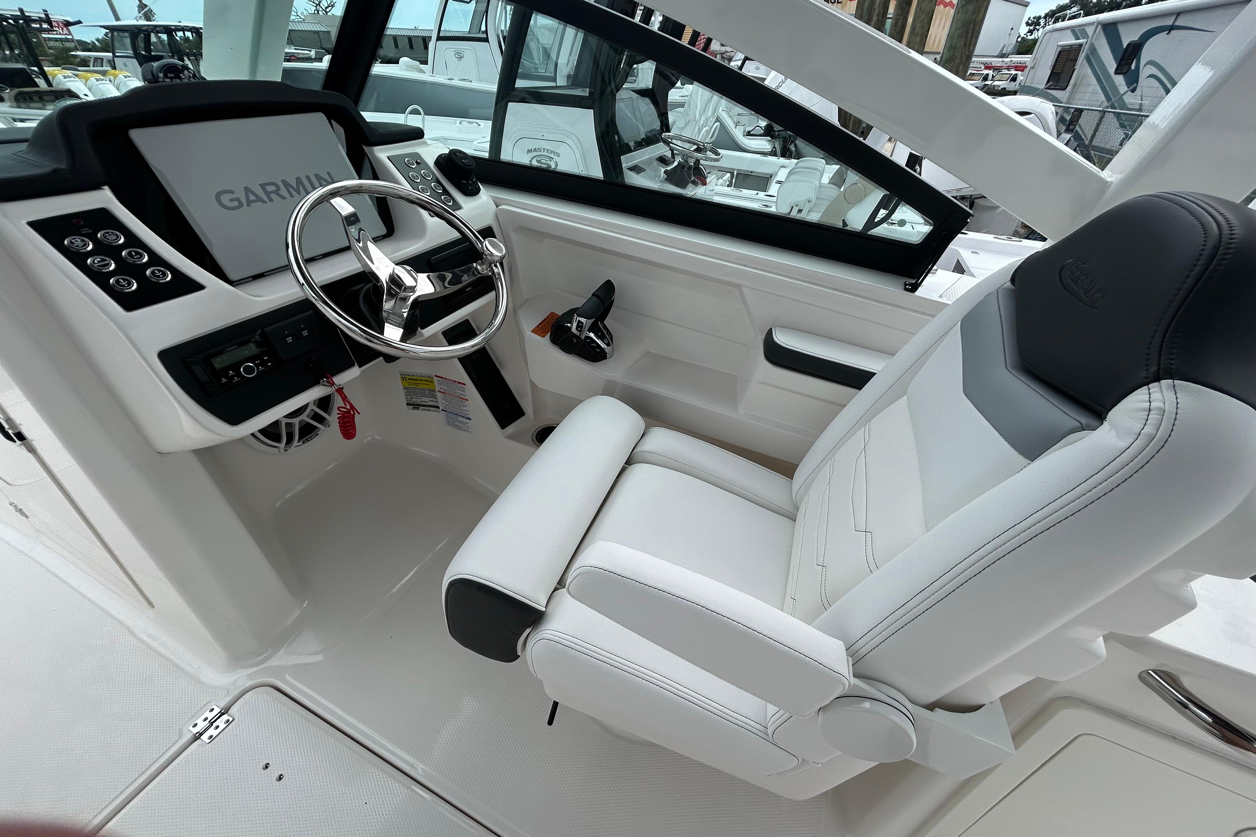 2026 Robalo R257 Dual Console cockpit with Garmin navigation and luxurious seating.
