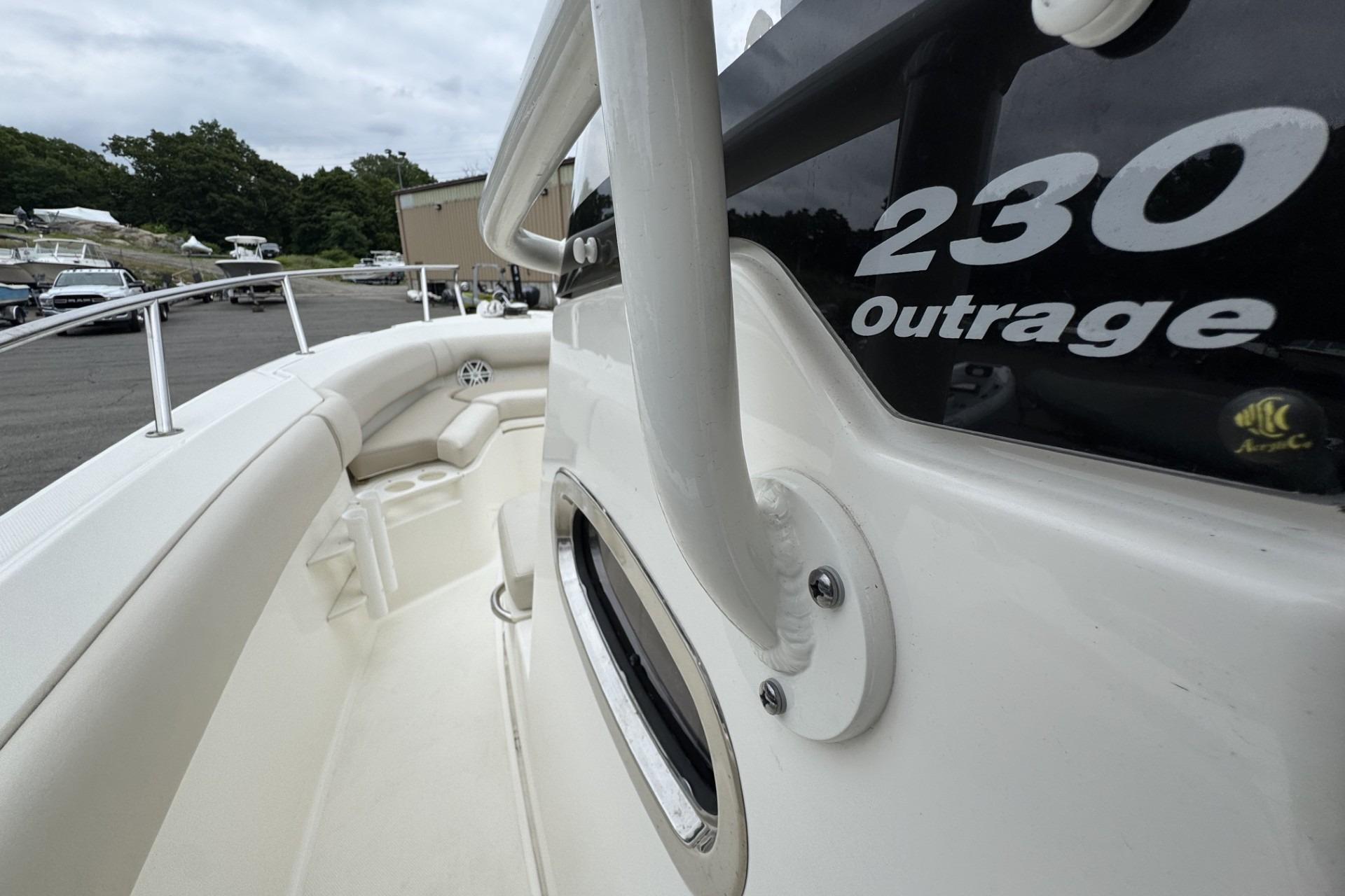 2024 Boston Whaler 230 Outrage boat, showcasing sleek design and spacious seating area.