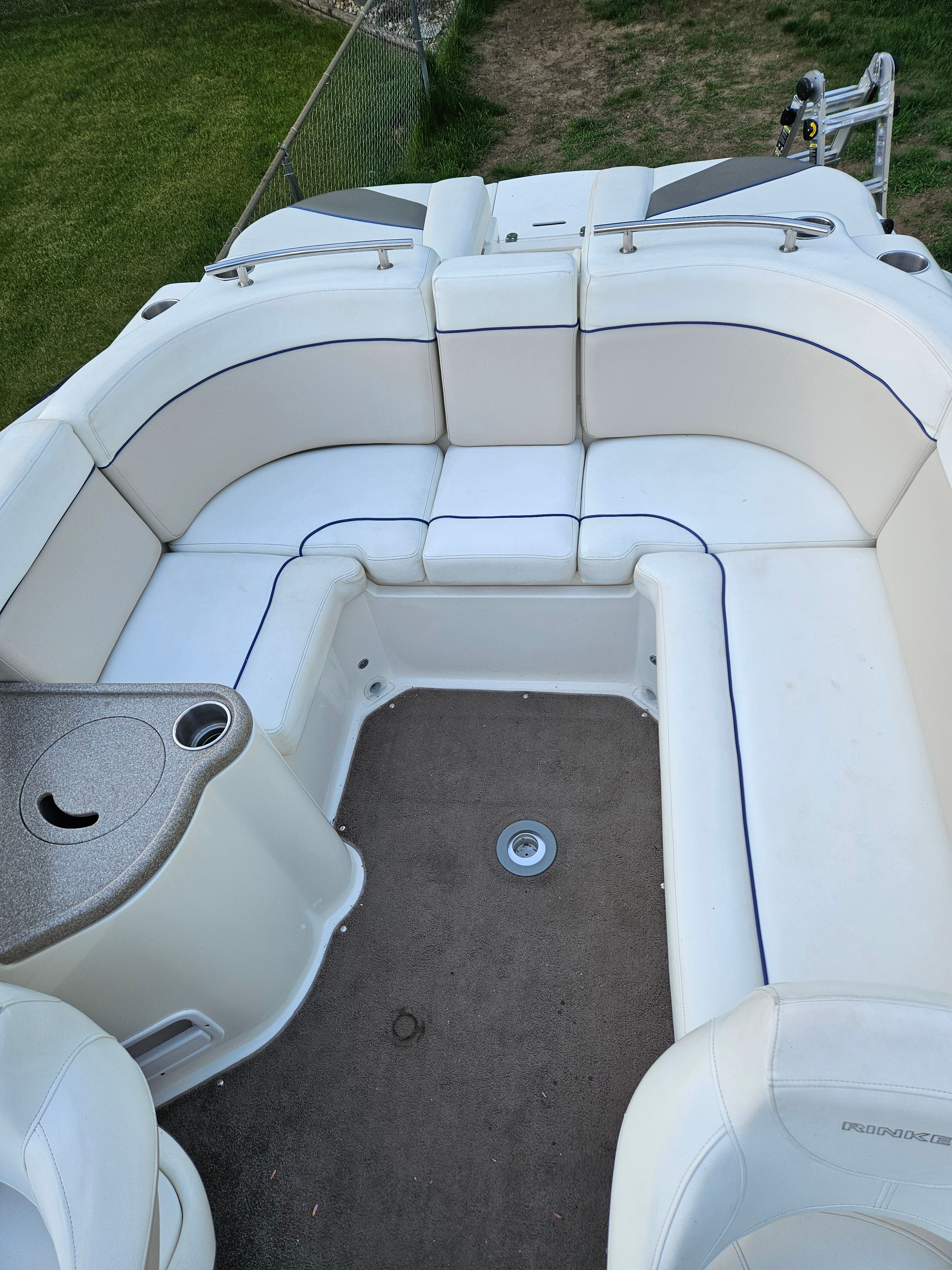 Interior of a 2009 Rinker Captiva DB boat with seating area.