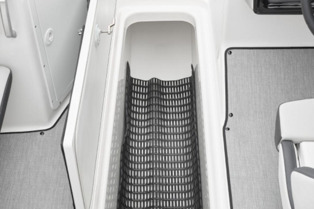 2026 Yamaha Boats SX250 storage compartment with non-slip mat and sleek interior design.
