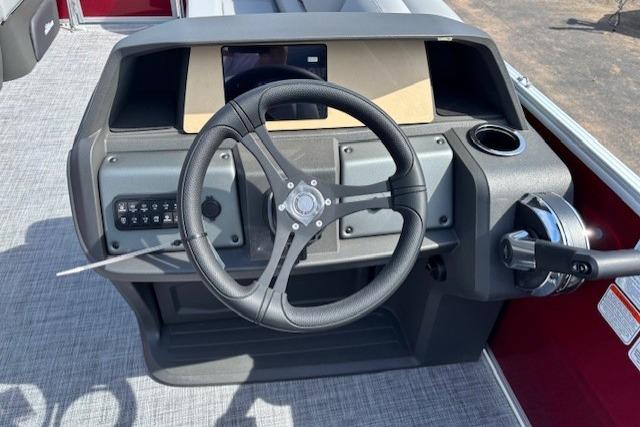 2026 Sun Tracker Party Barge 20 DLX steering console with modern controls and cup holder.
