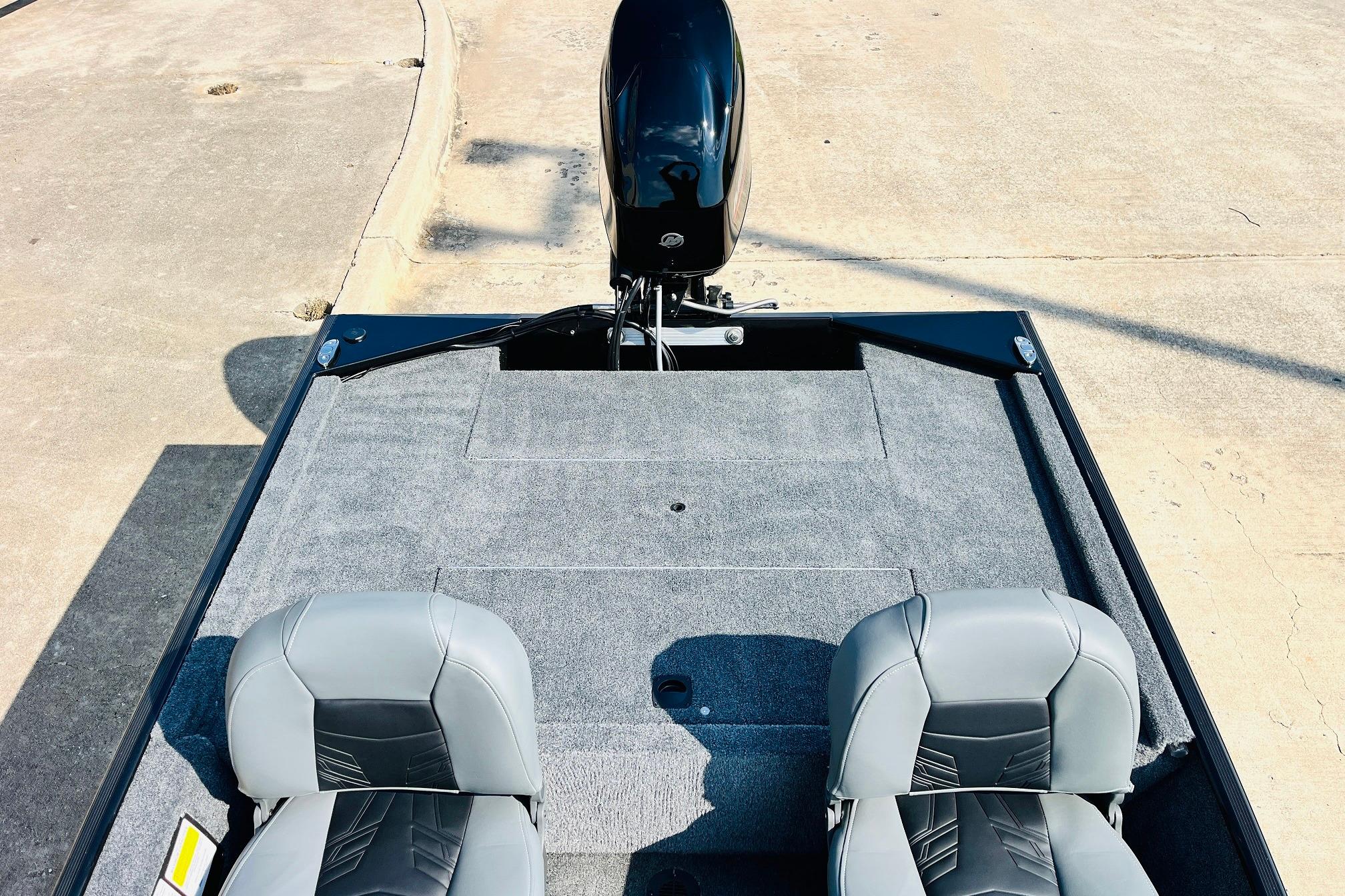 2026 Tracker Bass Tracker Classic XL boat interior with gray seats and carpeted deck.