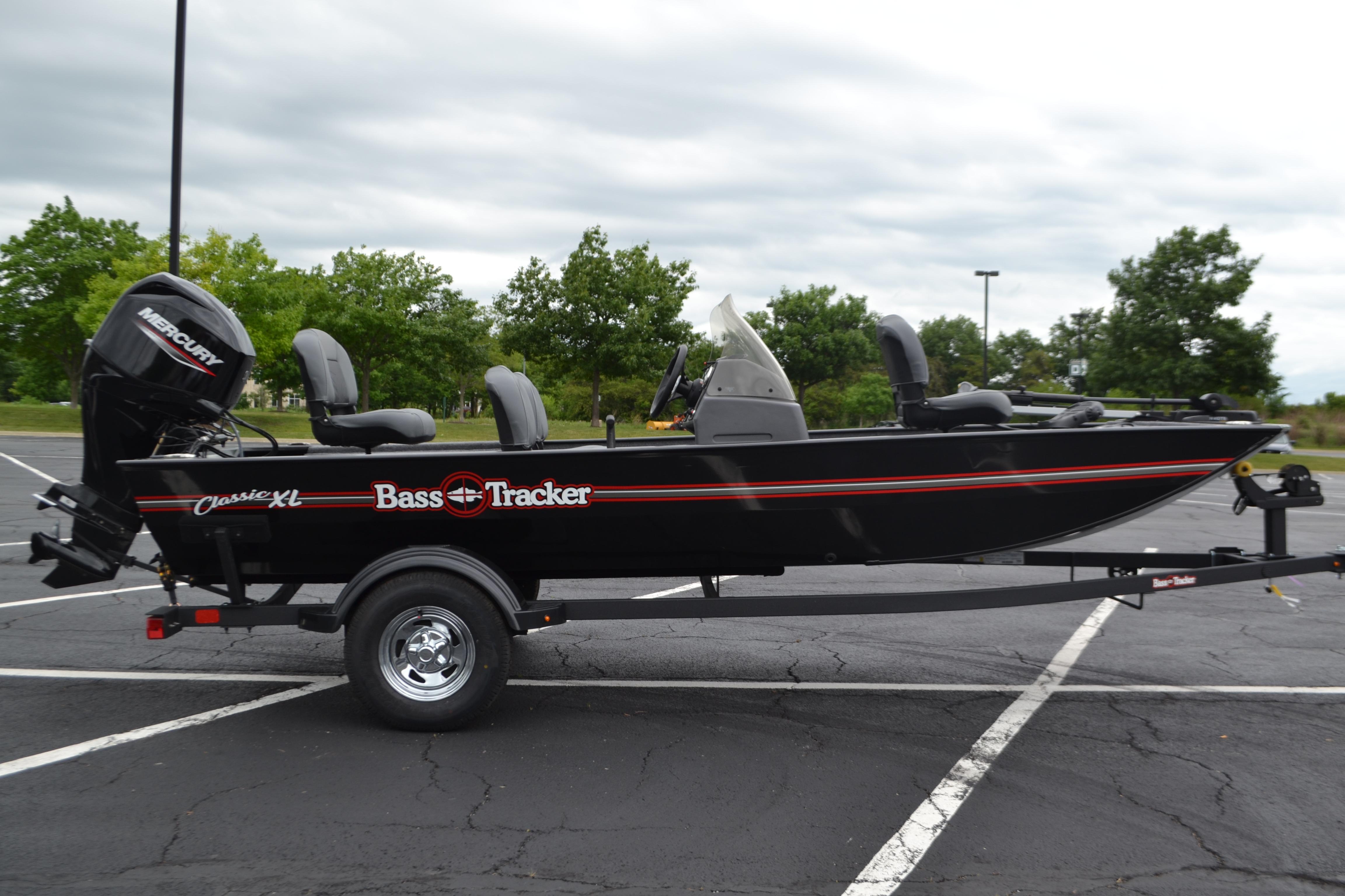 2026 Tracker Bass Tracker Classic XL boat on trailer in parking lot.