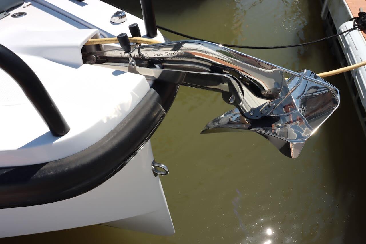Anchor detail of 2022 Axopar 37 XC Cross Cabin boat in marina.