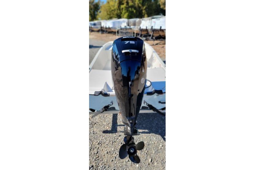 2026 Mako Pro Skiff 17 CC with Mercury 75 outboard motor, parked outdoors.