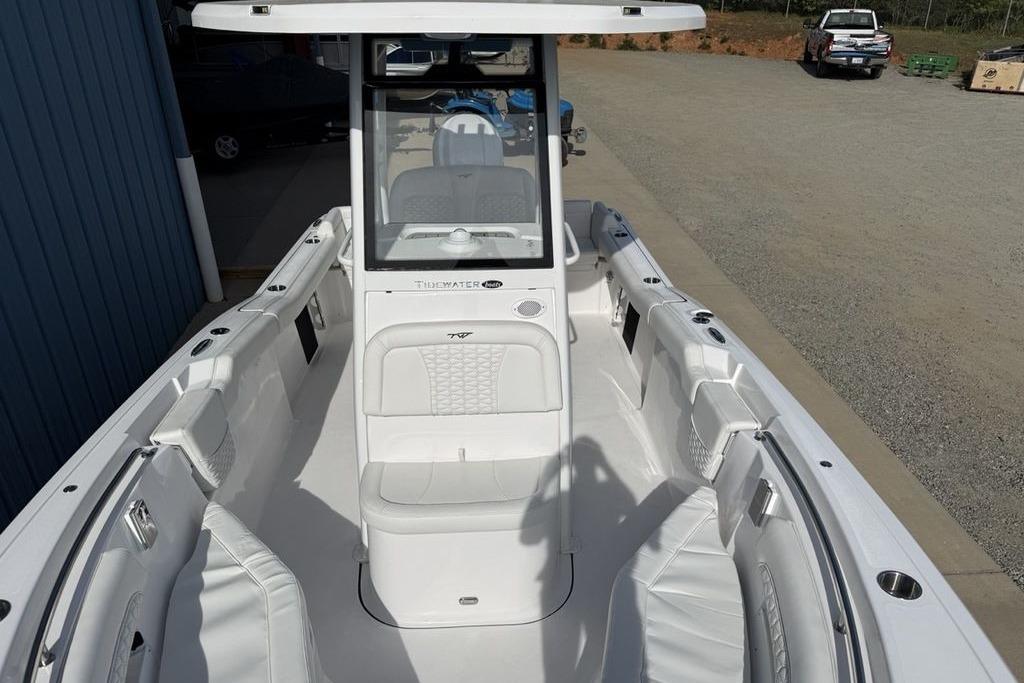 2026 Tidewater 232 LXF boat interior with white seating and console.