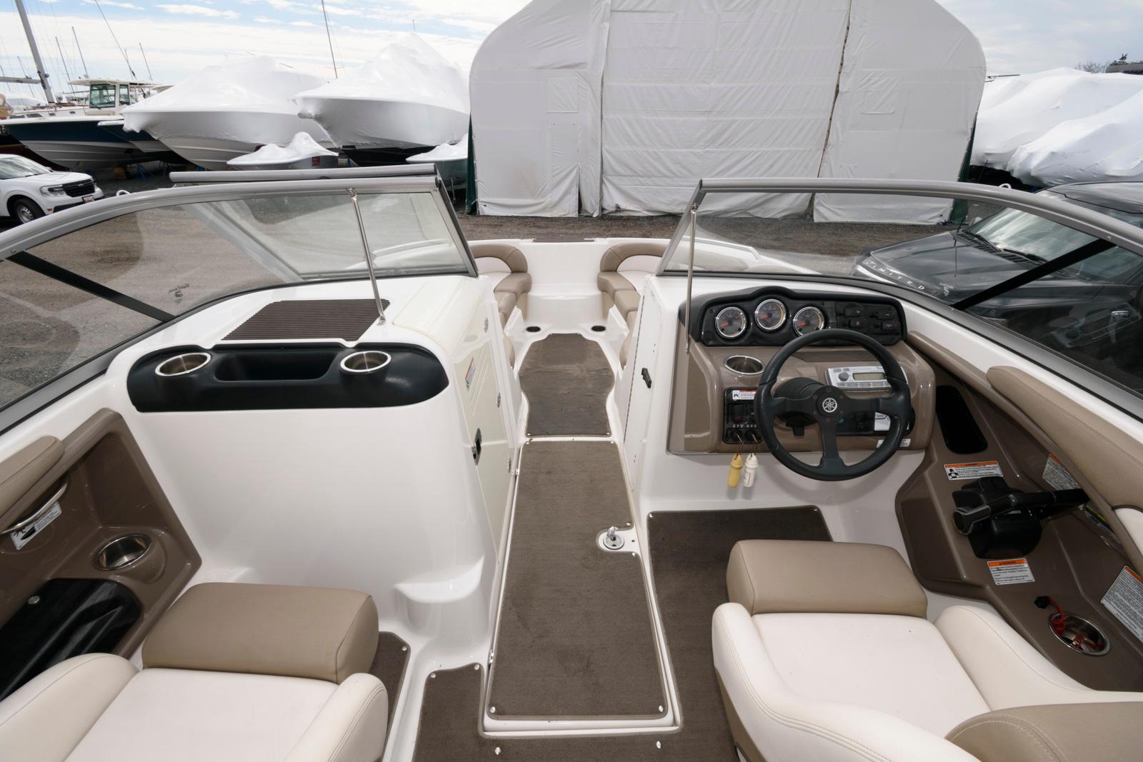 2011 Yamaha Boats 242 Limited interior with dual consoles and seating.