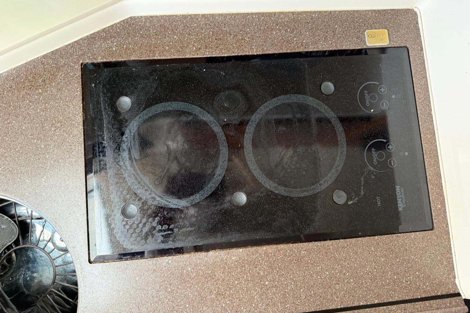Built-in stovetop on 2009 Grady-White Express 330 boat, featuring dual burners.