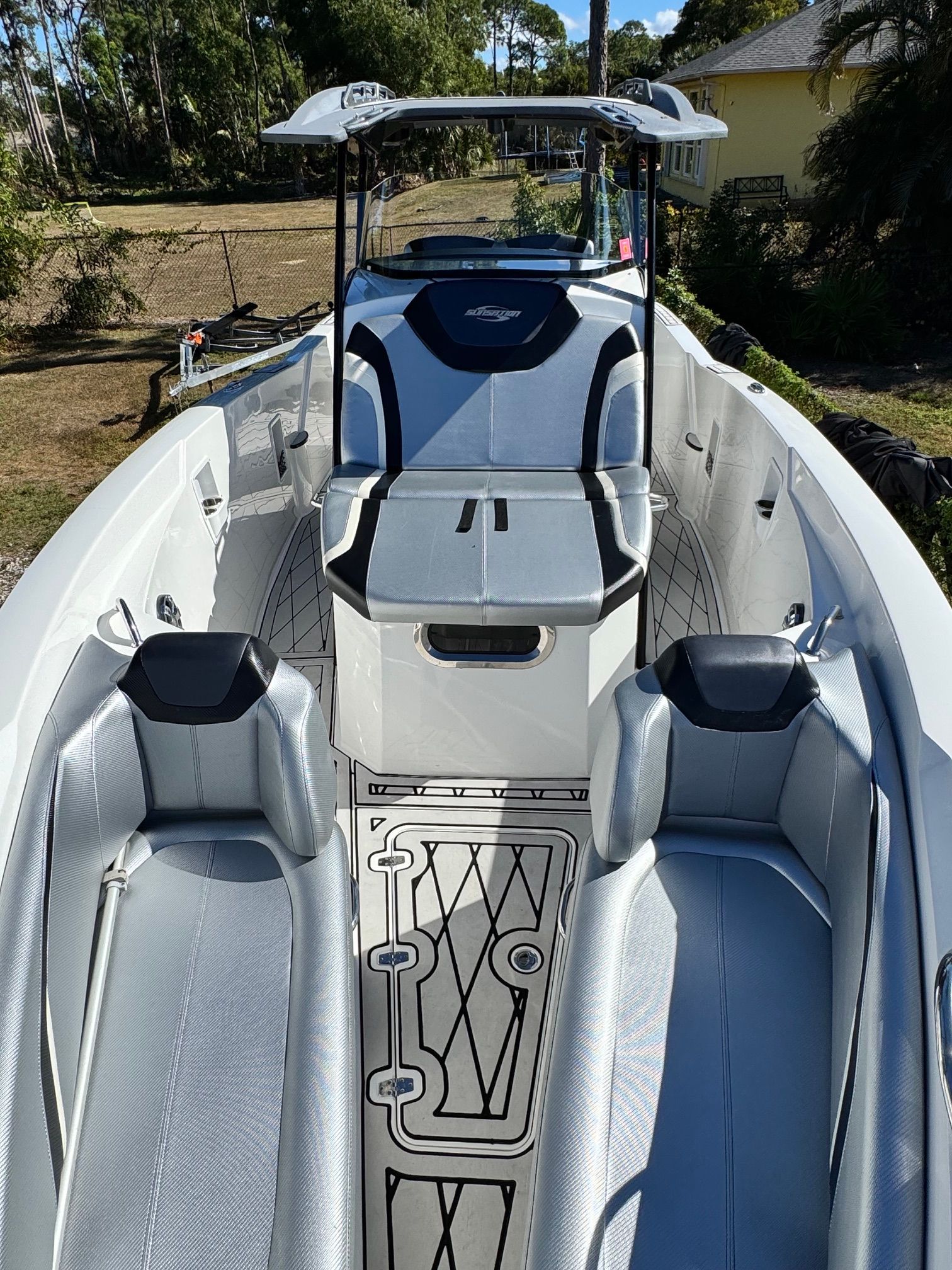 Interior view of a 2017 Sunsation 32 CCX boat with gray seating.