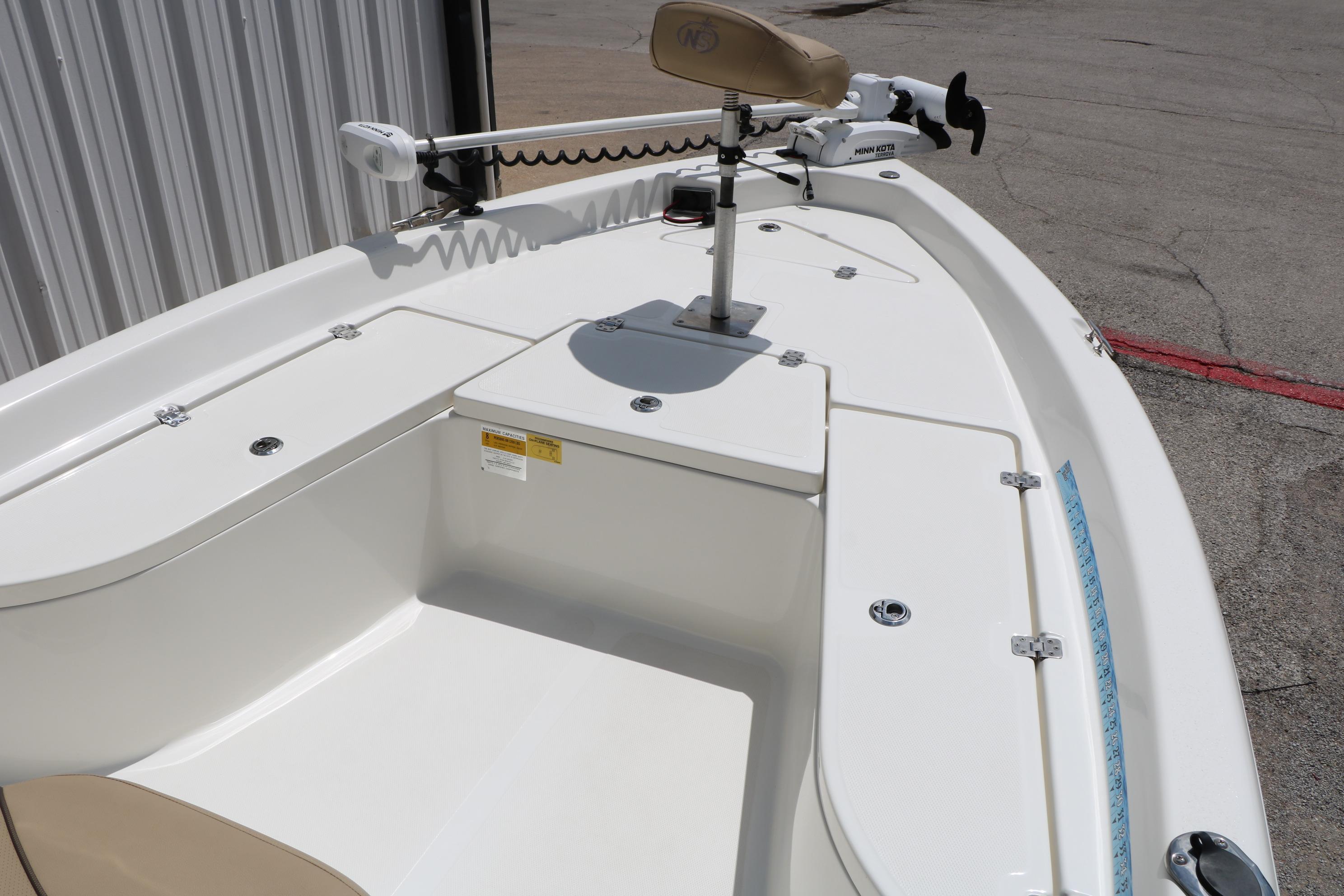 2020 NauticStar 2140 Sport boat deck with seating and trolling motor.