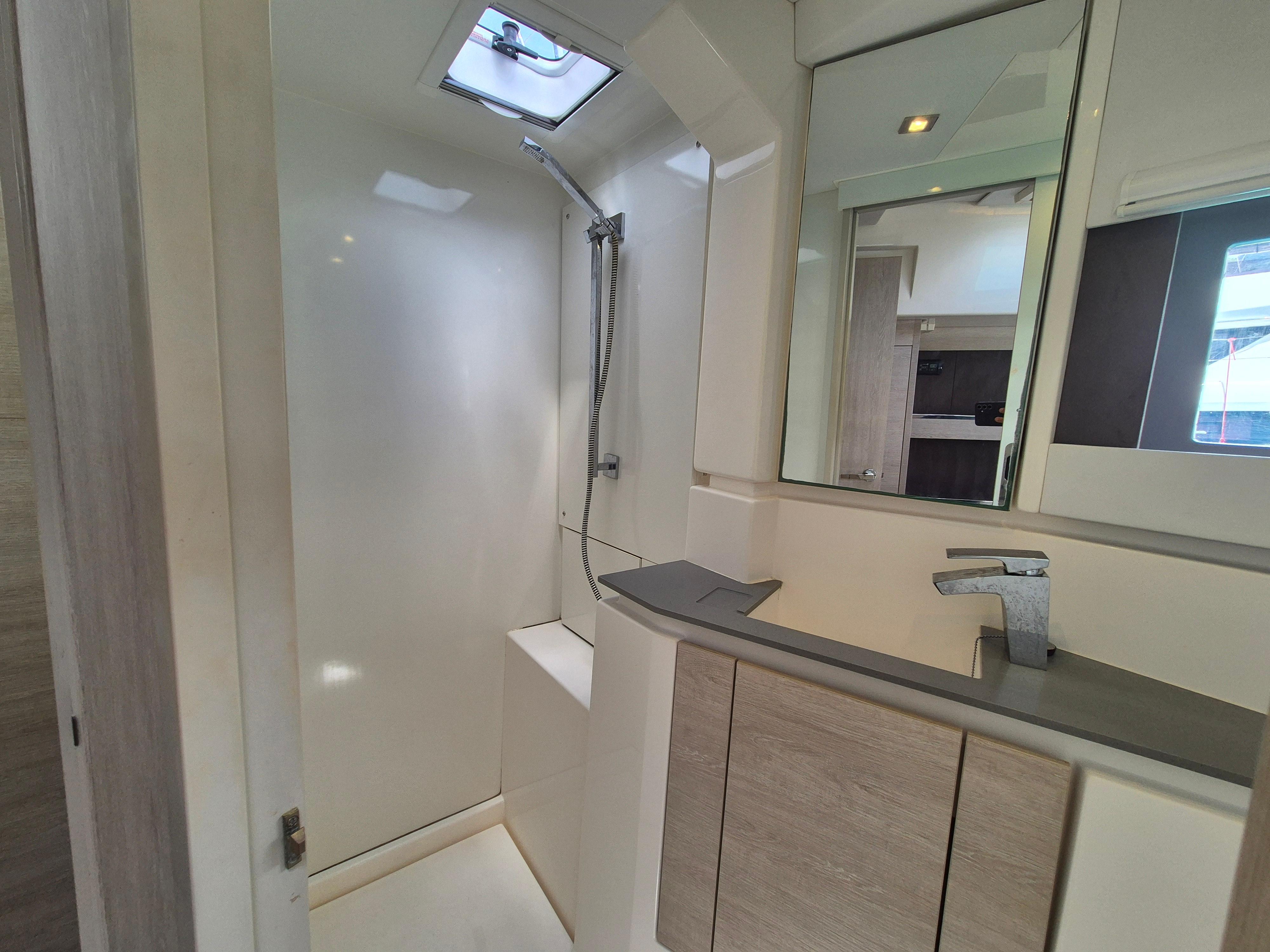 Modern bathroom interior in a 2020 Leopard 50 yacht, featuring sleek fixtures and a shower.