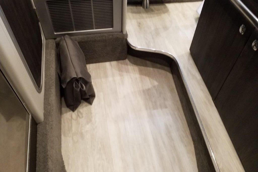 Interior of 2021 Formula 350 Sun Sport boat with modern flooring and cabinetry.