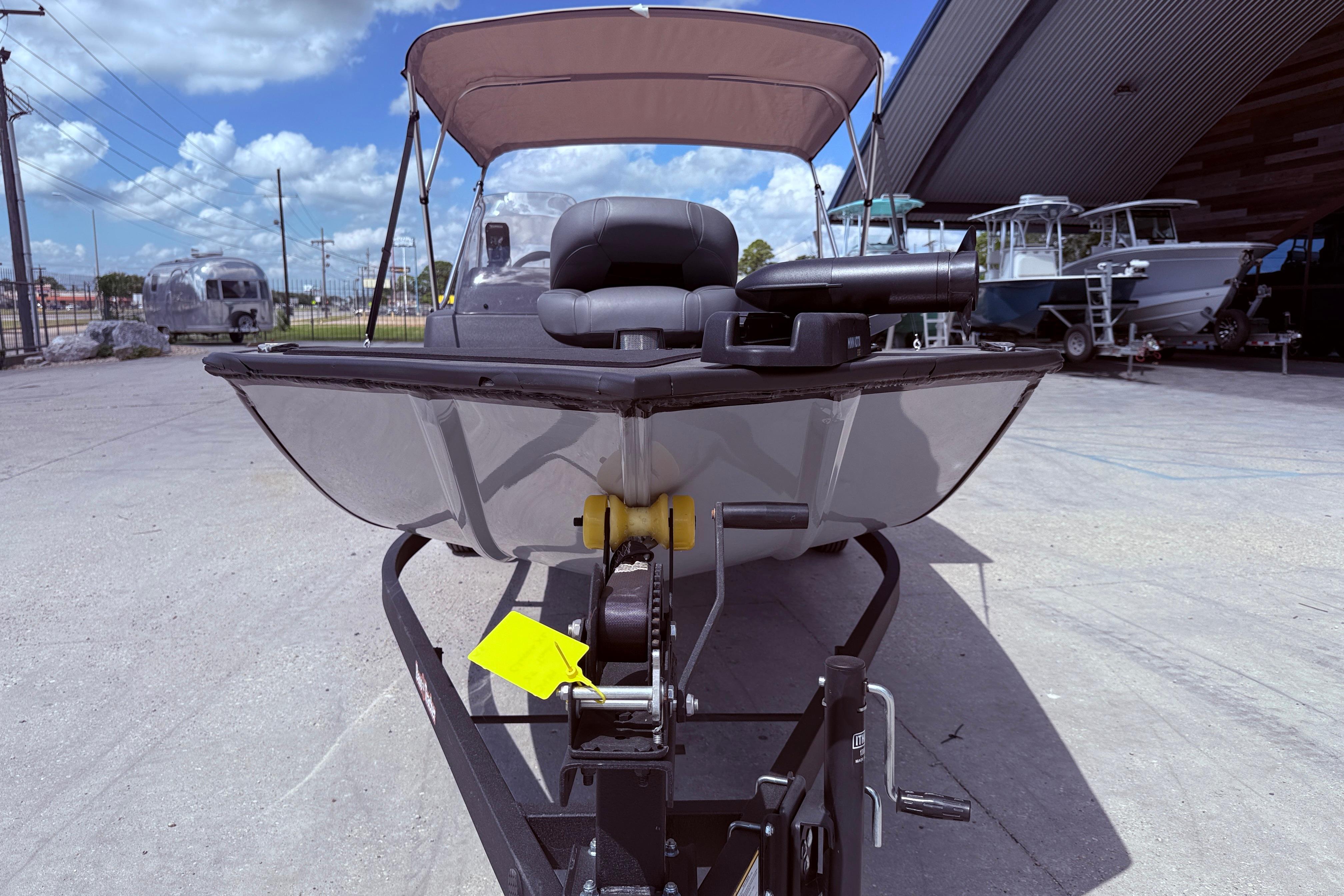 2025 Bass Tracker Classic XL boat on trailer under blue sky.