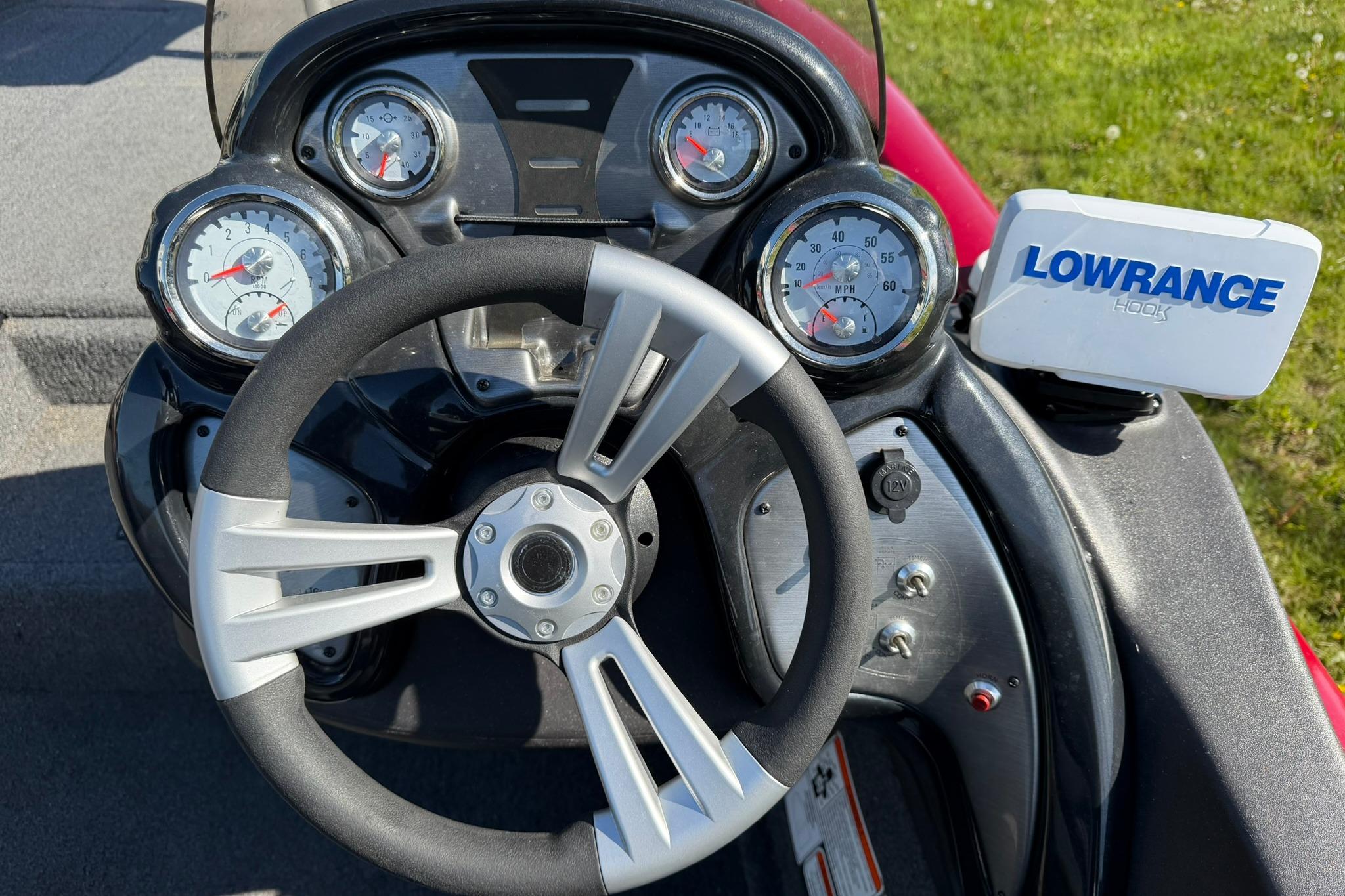 Steering console of 2024 Tracker Pro Team 175 TXW with Lowrance Hook display.