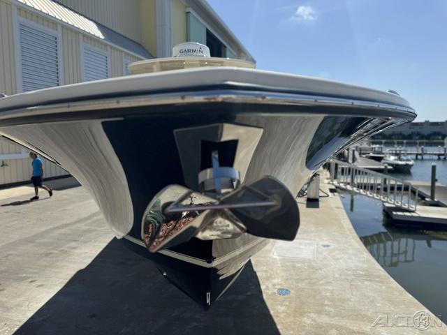 2022 Scout 330 LXF boat docked, front view with propeller and Garmin equipment.