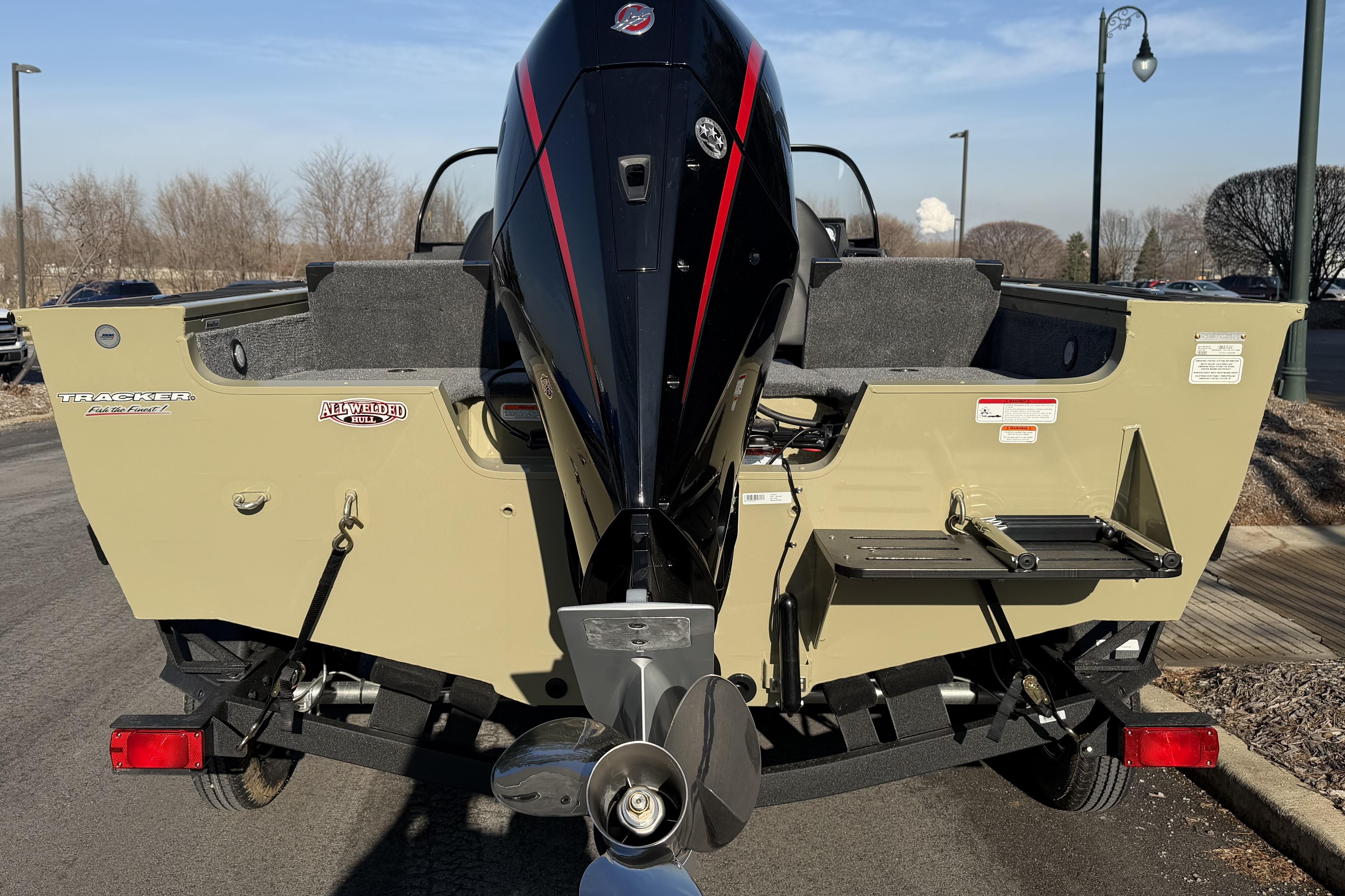 2026 Tracker Targa V-19 Combo boat rear view with outboard motor on trailer.