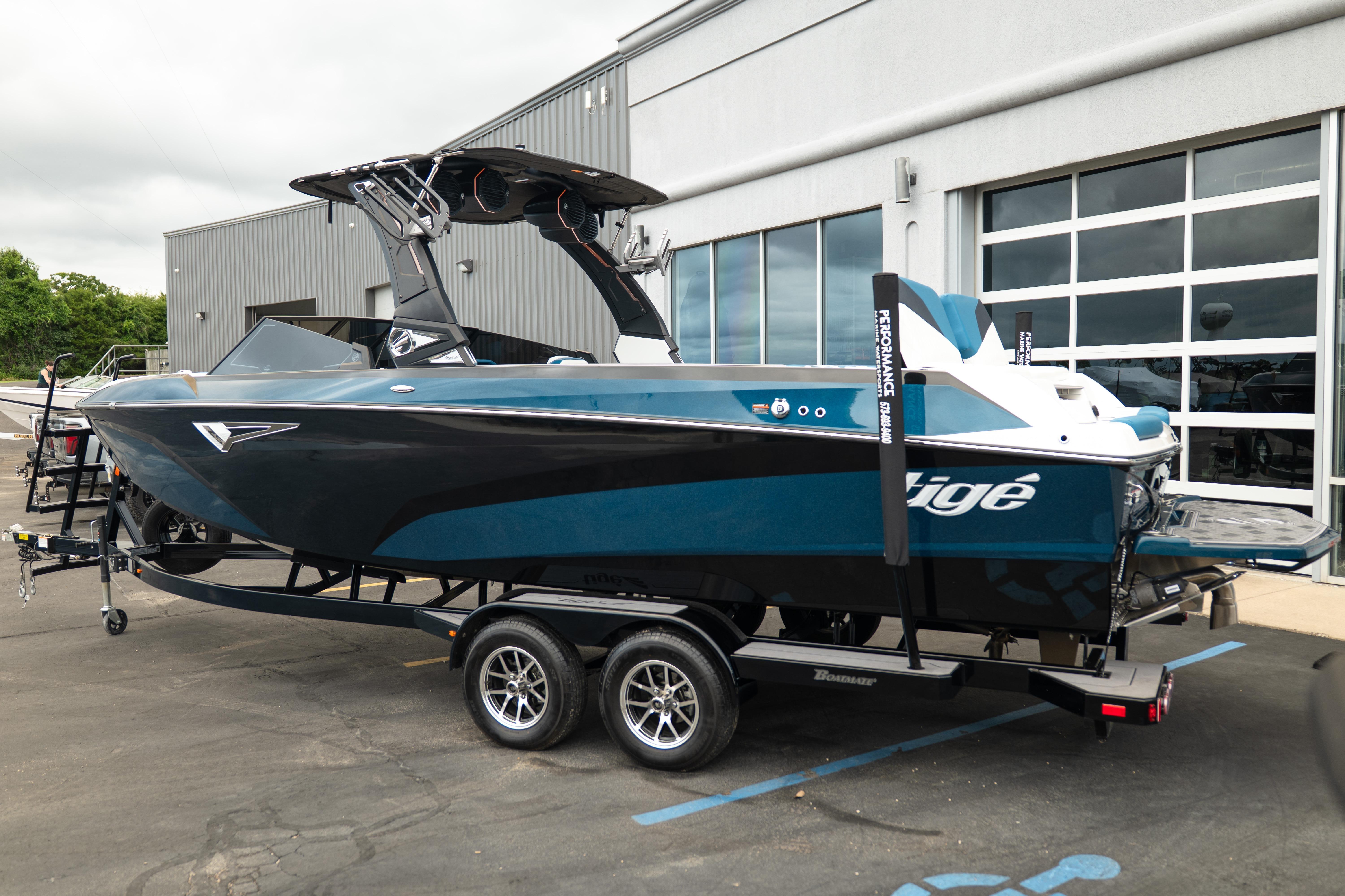 2024 Tigé Z5 boat on trailer outside a modern building.
