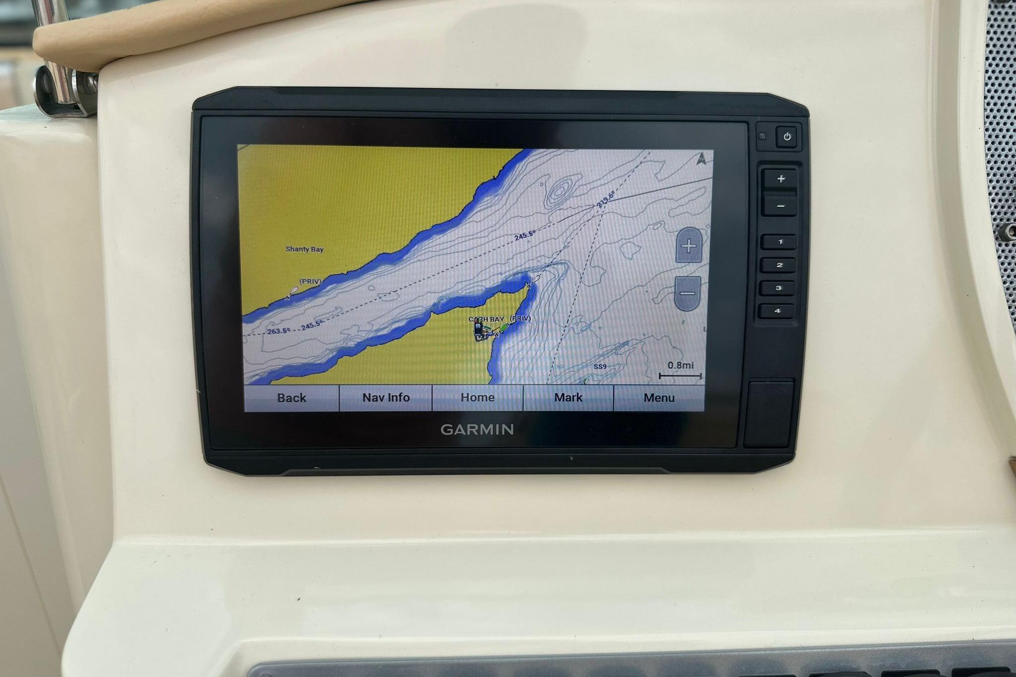 Garmin navigation display on 2013 Chris-Craft Launch 28 boat, showing a detailed marine map.