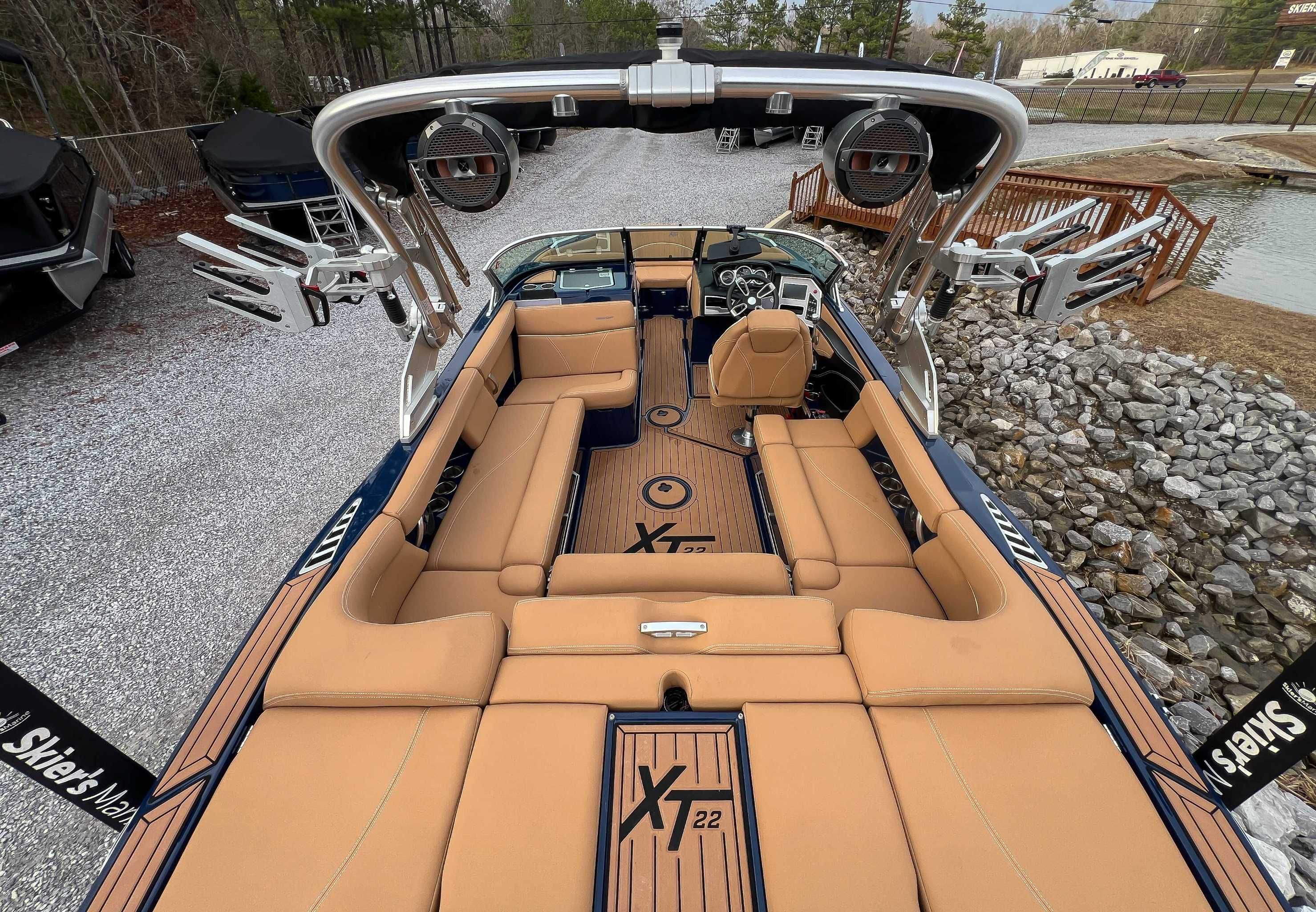 Interior view of a 2021 MasterCraft XT22 boat with luxurious seating.