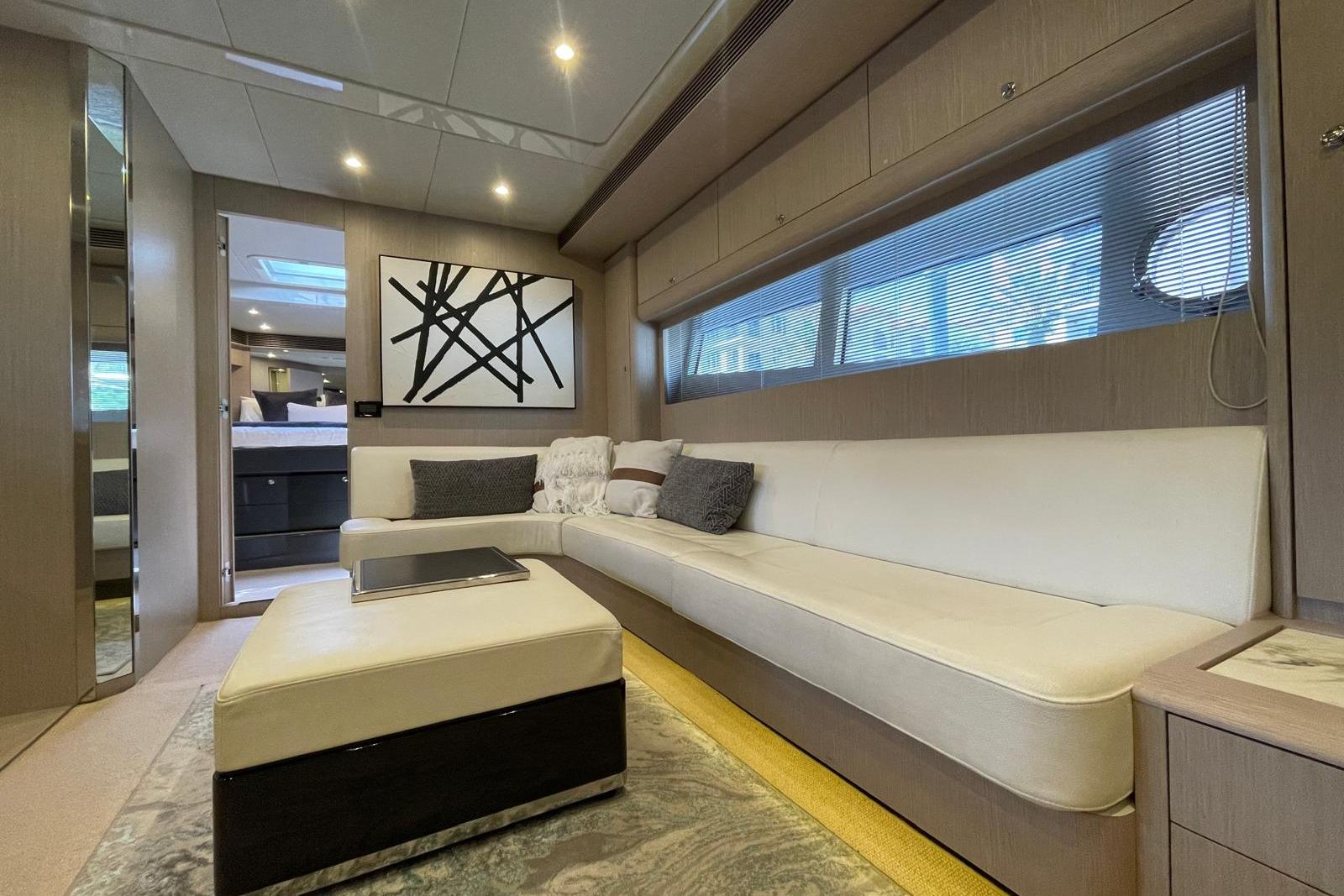 Luxurious interior of 2016 Riva 63 Virtus yacht with modern decor and comfortable seating.