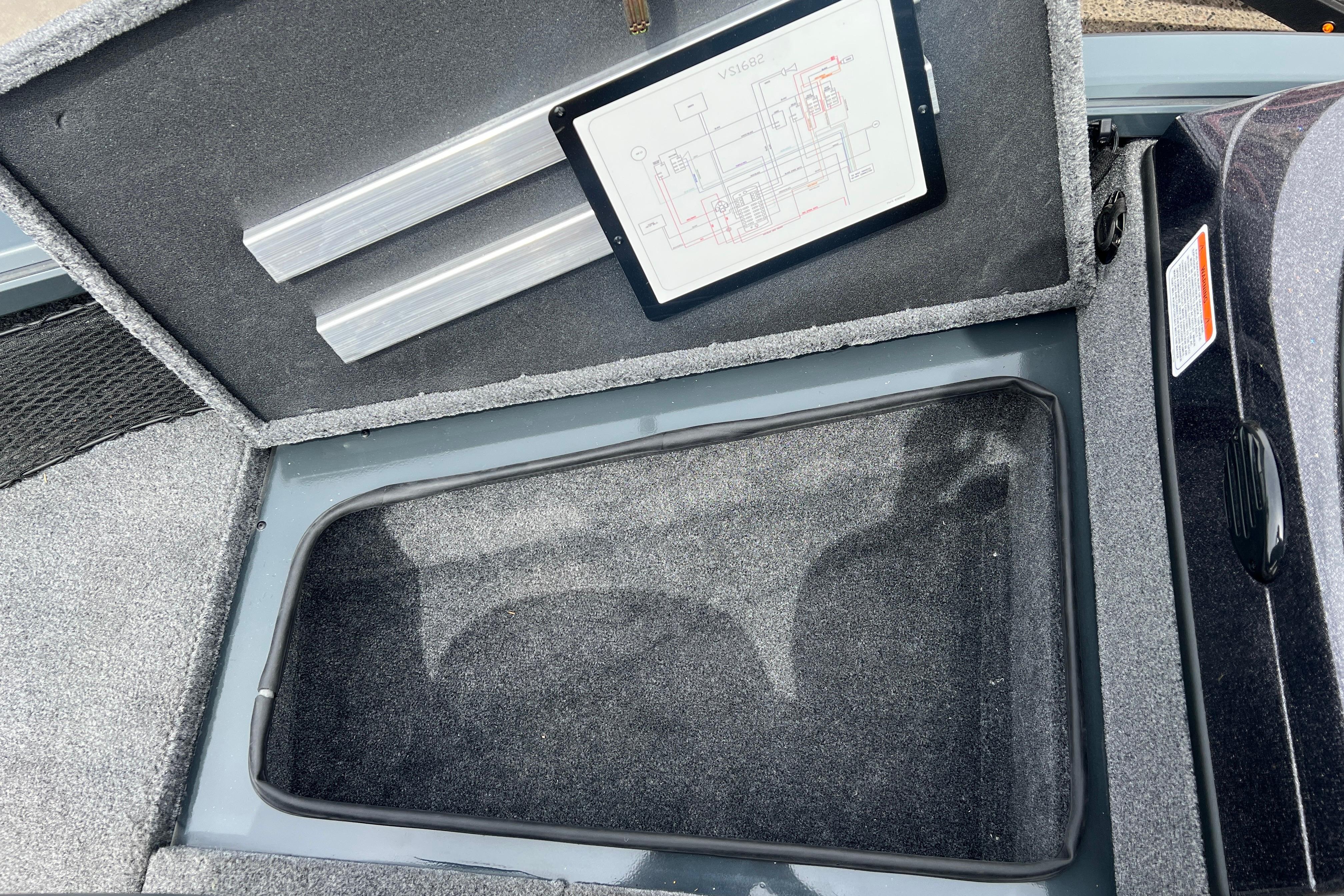 Open storage compartment in 2026 Ranger VS1682SC Angler boat with schematic diagram.