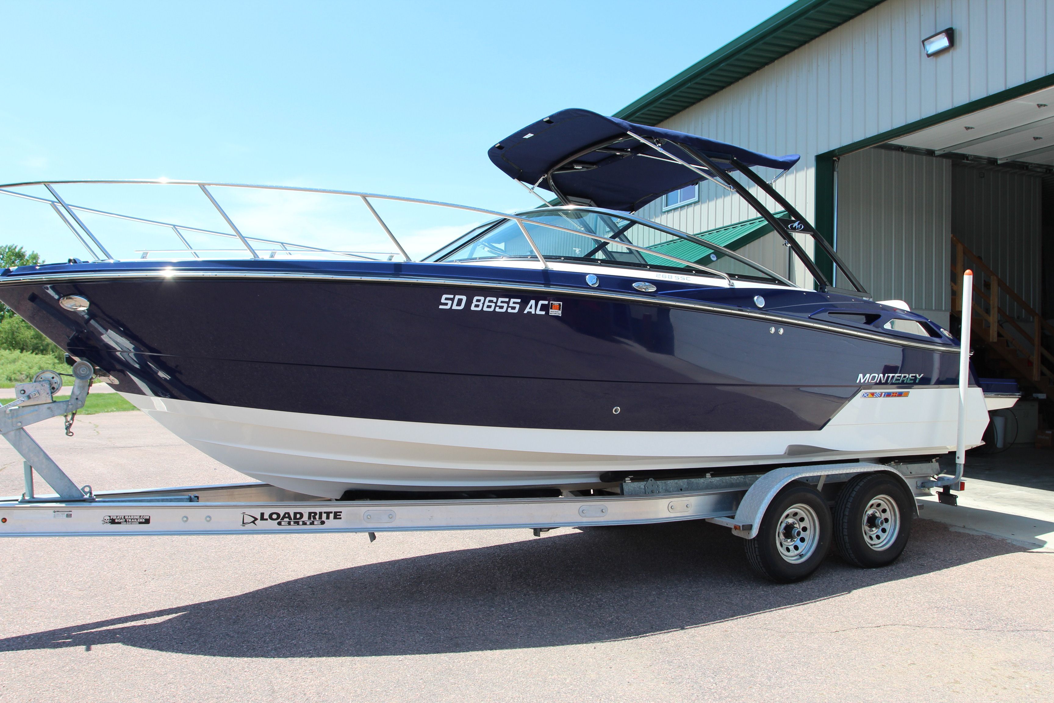 2015 Monterey 268SSC boat on trailer outside storage facility.
