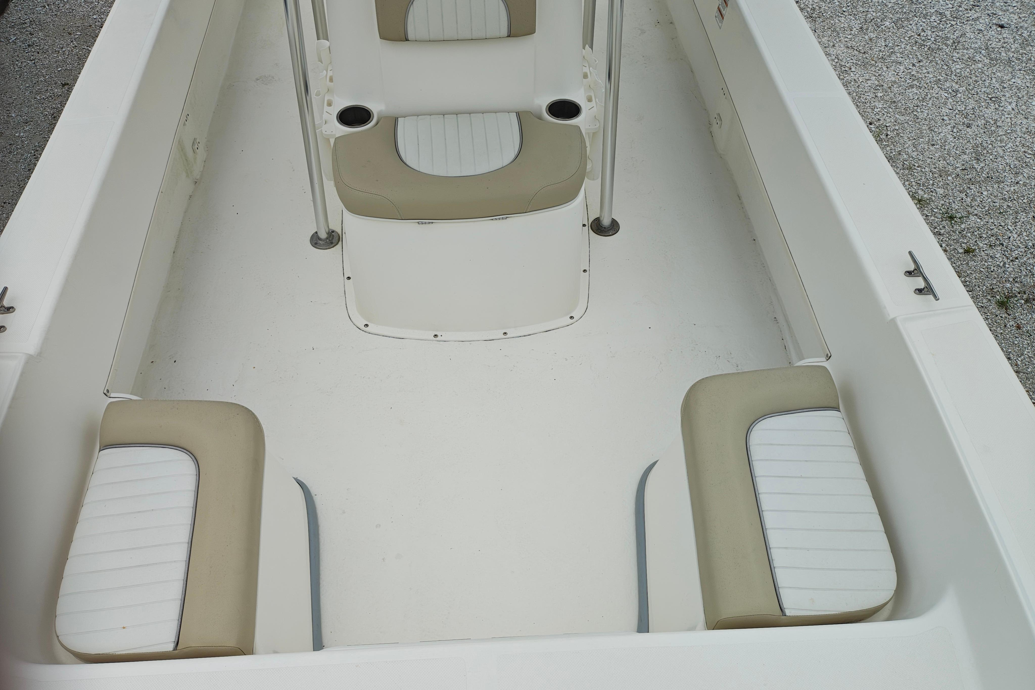 2018 Sundance B20CCR boat interior with beige and white seating.