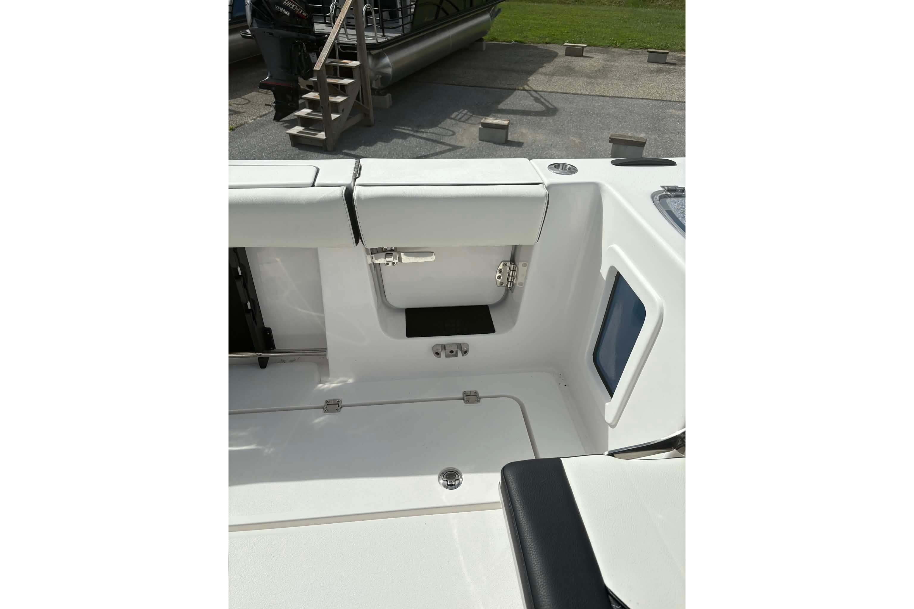 2026 Tidewater 282 CC Adventure boat interior with seating and storage compartments.