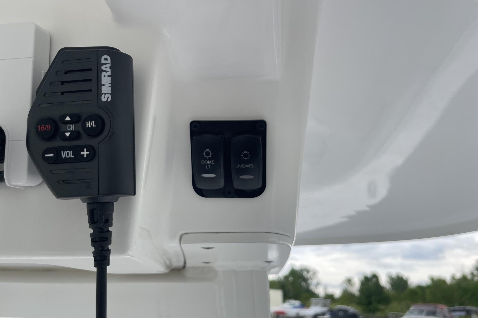 Simrad radio and control switches on 2026 Hurricane Center Console 24 OB boat.