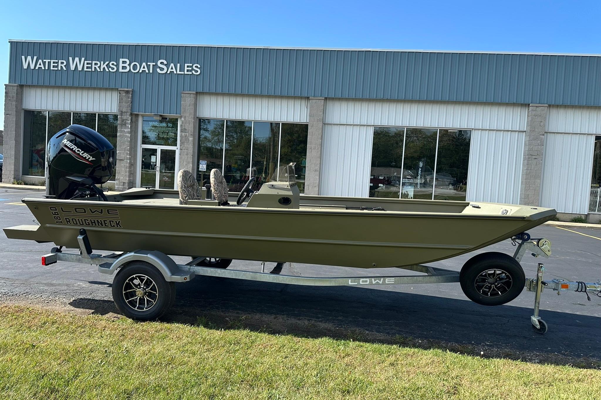 2026 Lowe Roughneck 1860SC boat on trailer outside Water Werks Boat Sales.