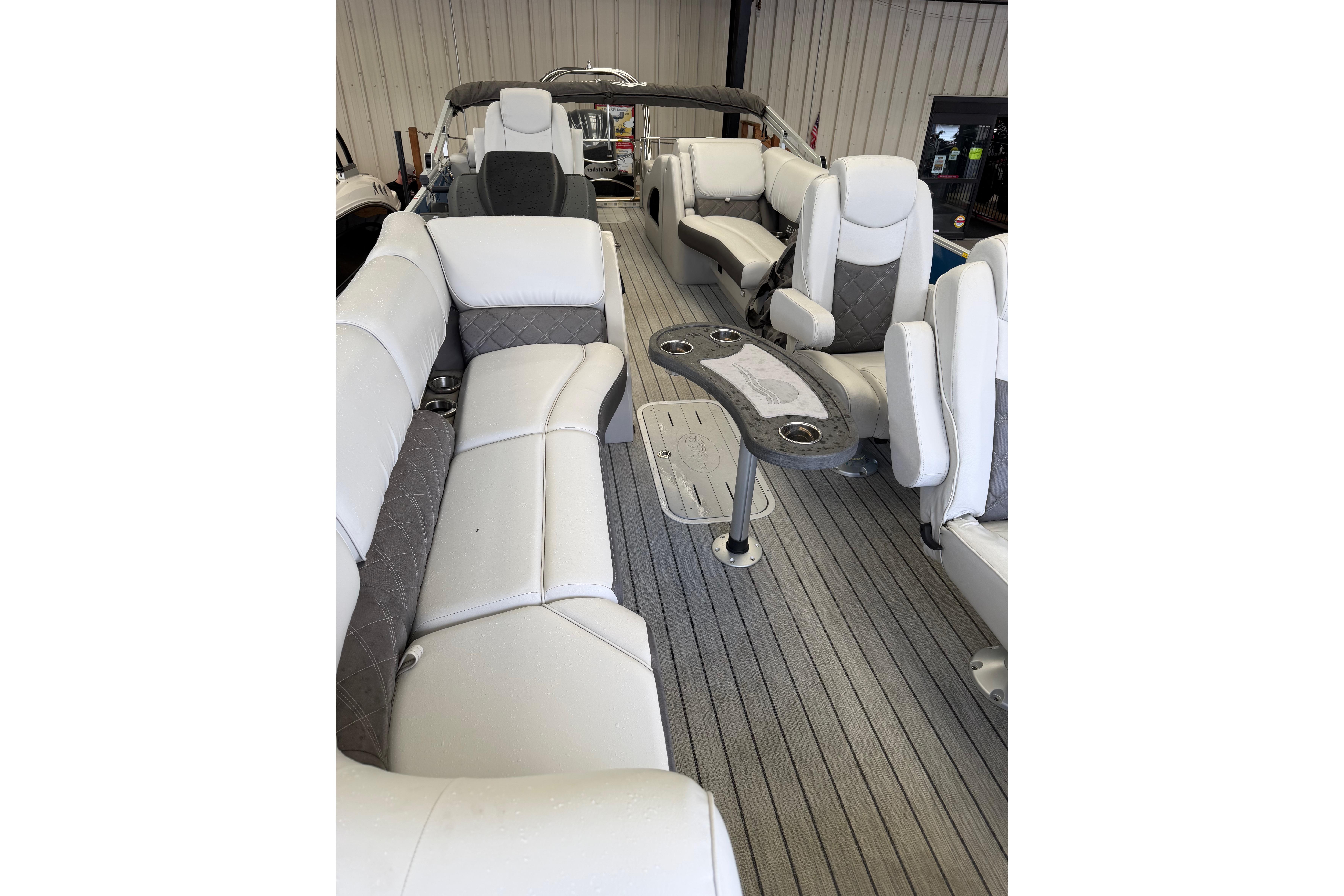 2024 SunCatcher Elite 326 SS DLX boat interior with luxurious seating and modern design.