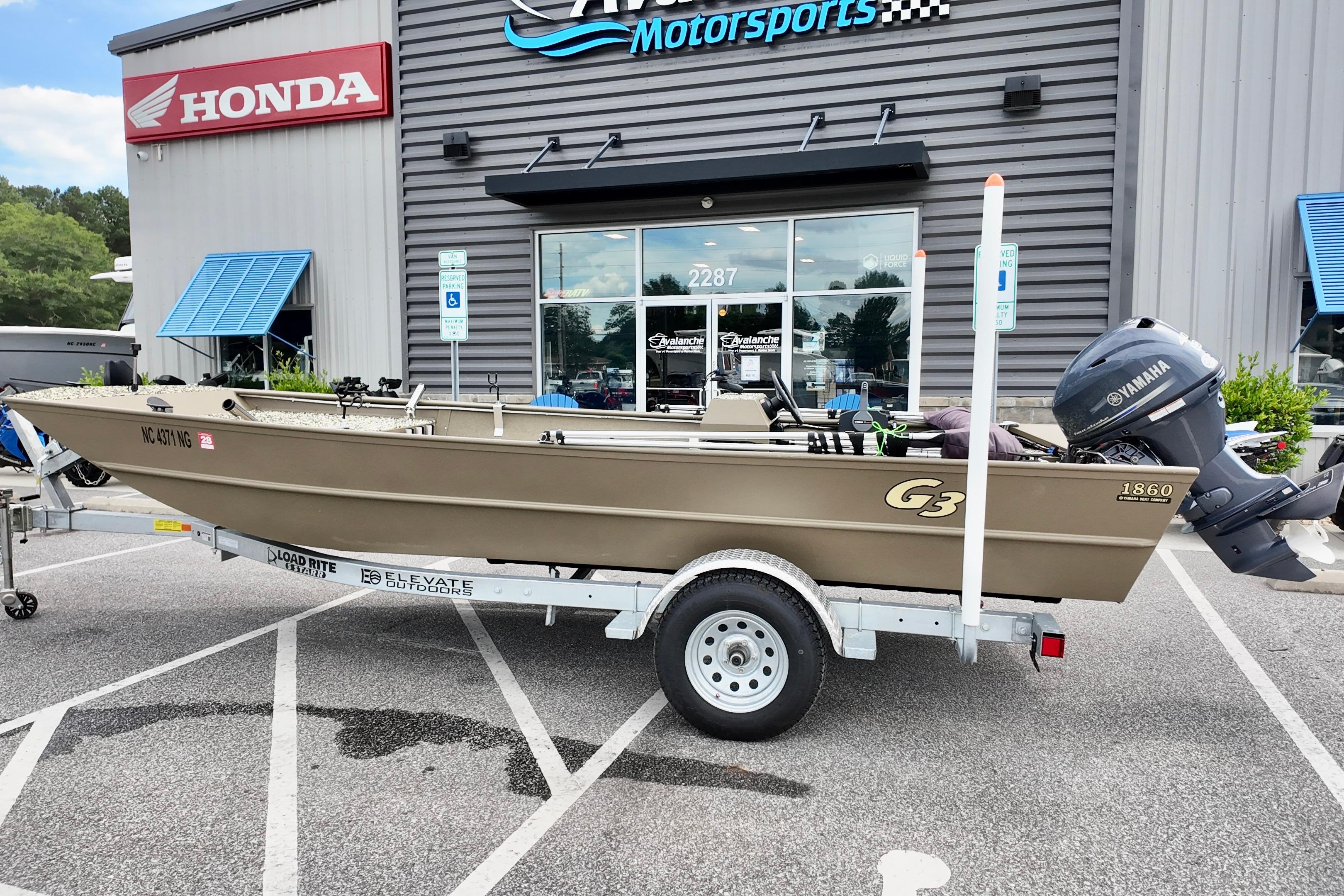 2025 G3 BOATS 1860 SC on trailer outside dealership with Honda signage.