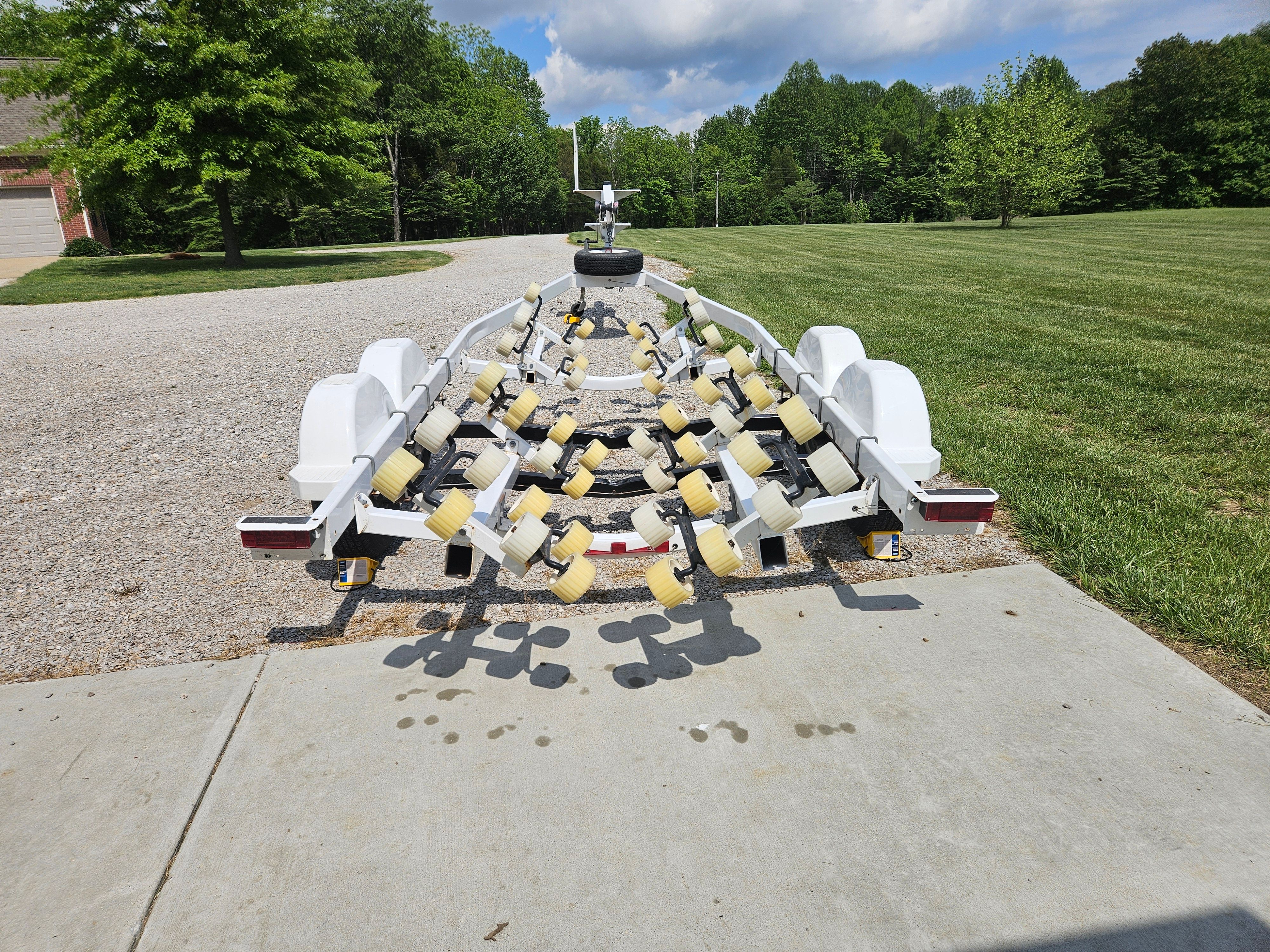 Yacht Club boat trailer R2466TB, year 2010, parked on driveway.