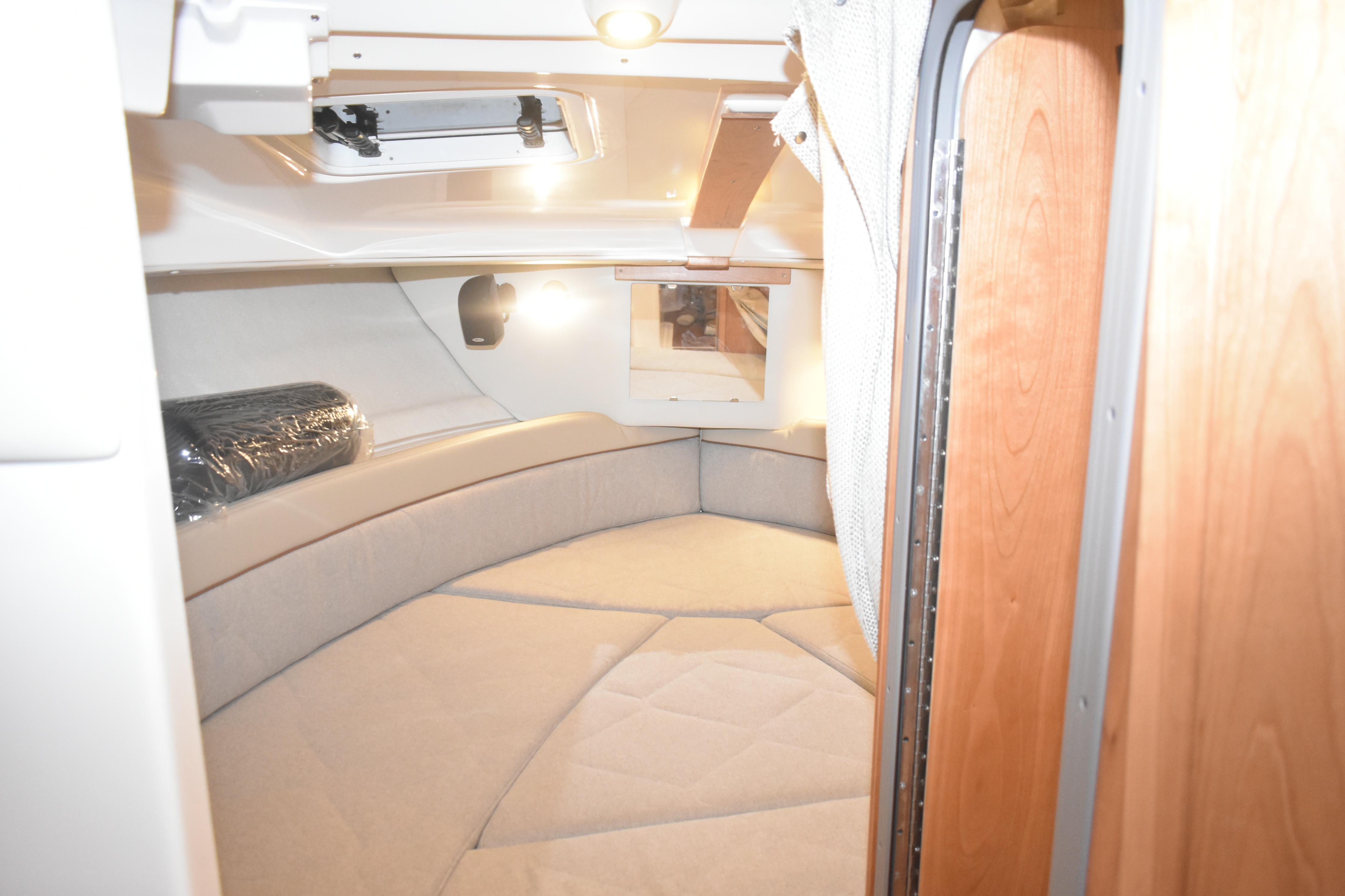 Interior cabin of 2026 Cutwater C-248 Coupe, featuring cozy seating and ambient lighting.