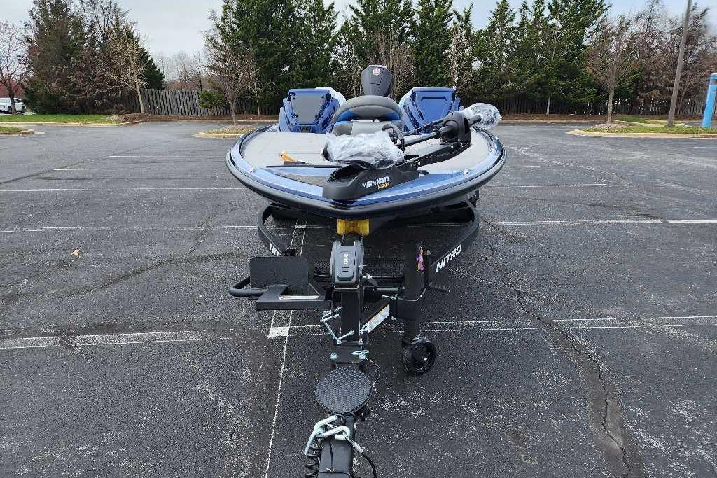 2026 Nitro Z20 XL boat parked in an empty lot, featuring a sleek design.
