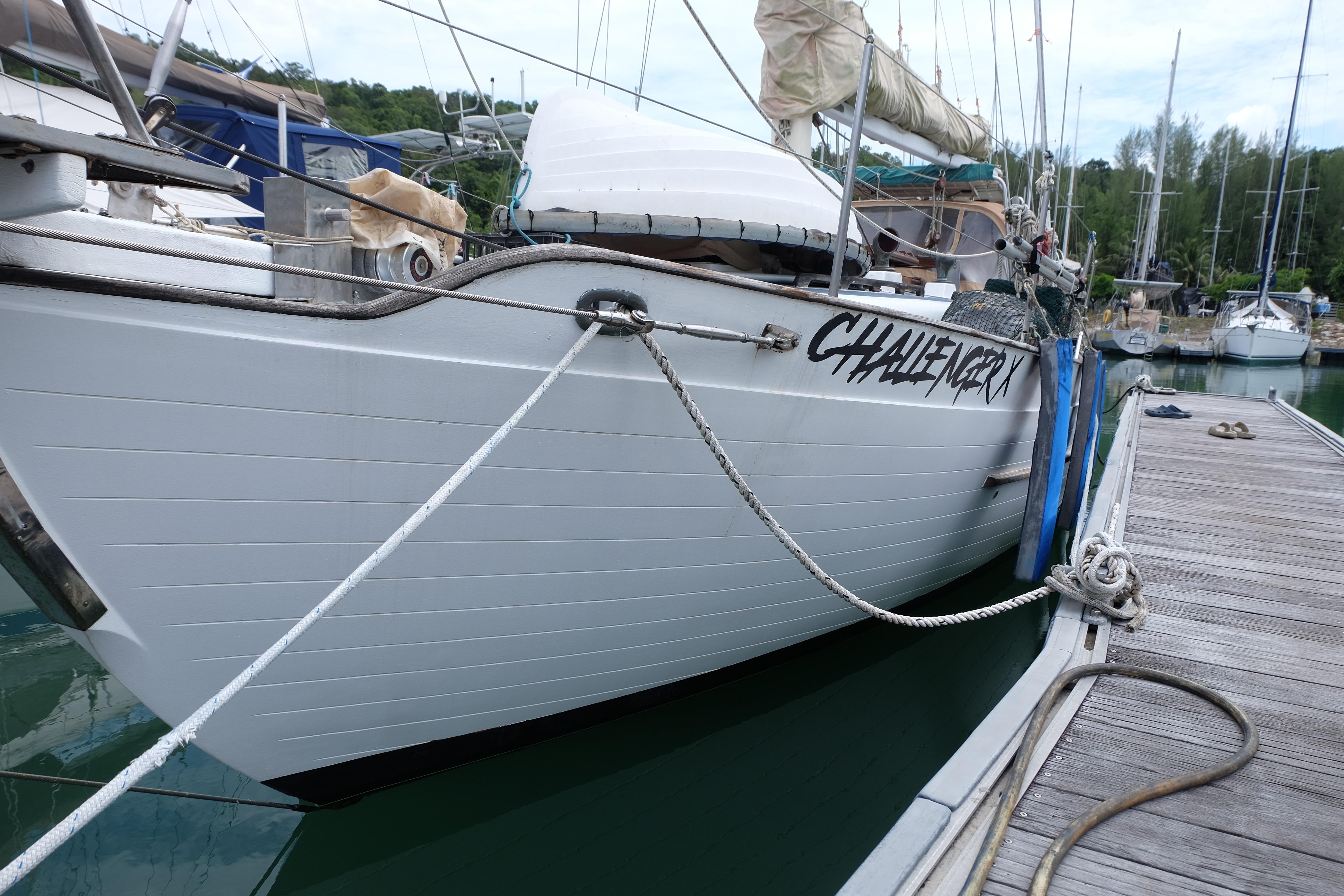 1979 Westwind 35 sailboat "Challenger X" docked at marina, side view.