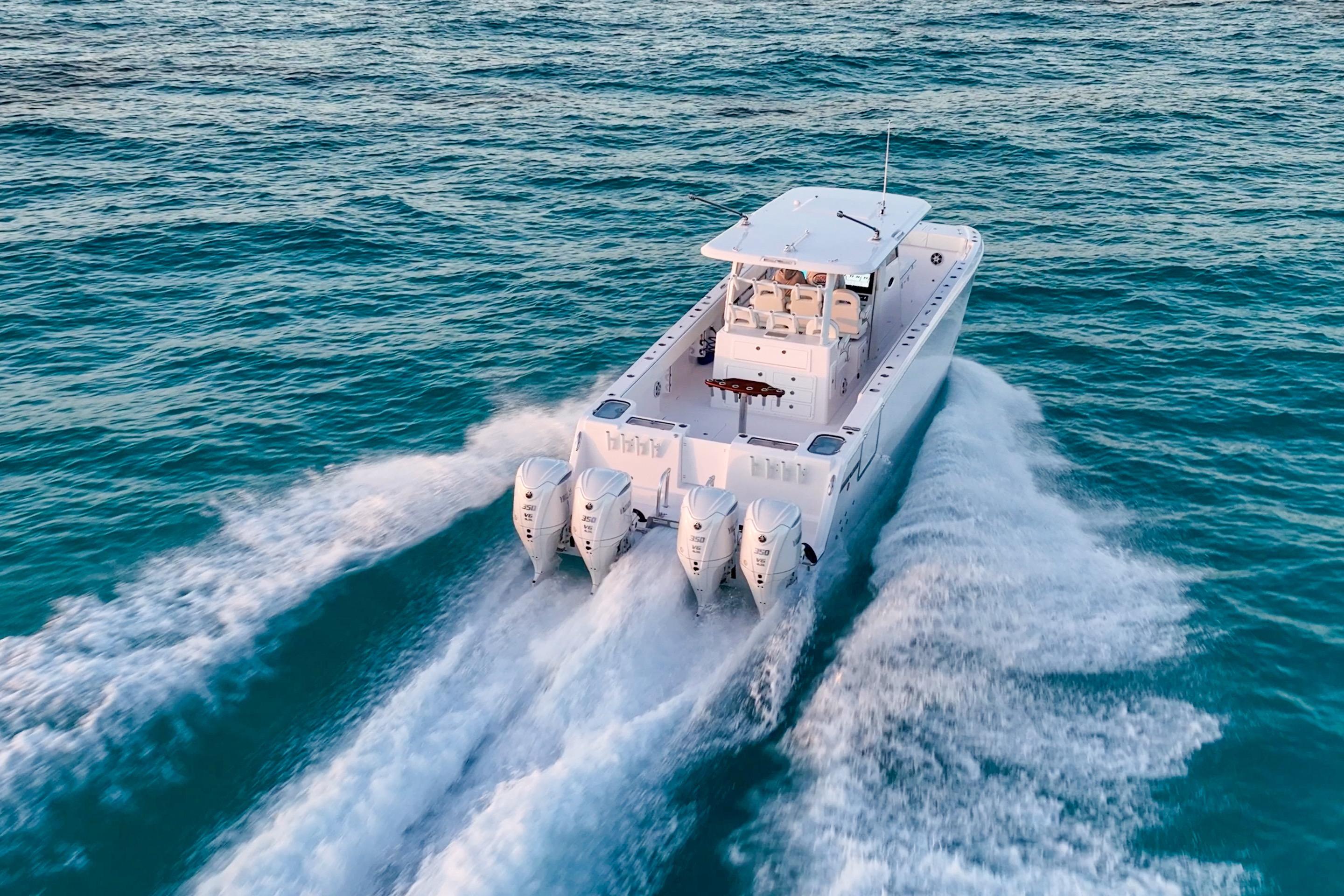 Twin Vee 400 GFX2 CC 2026 cruising on open water with triple engines.