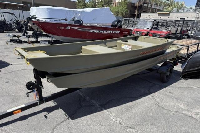 2026 Tracker Grizzly 12 Jon boat on trailer in outdoor lot.
