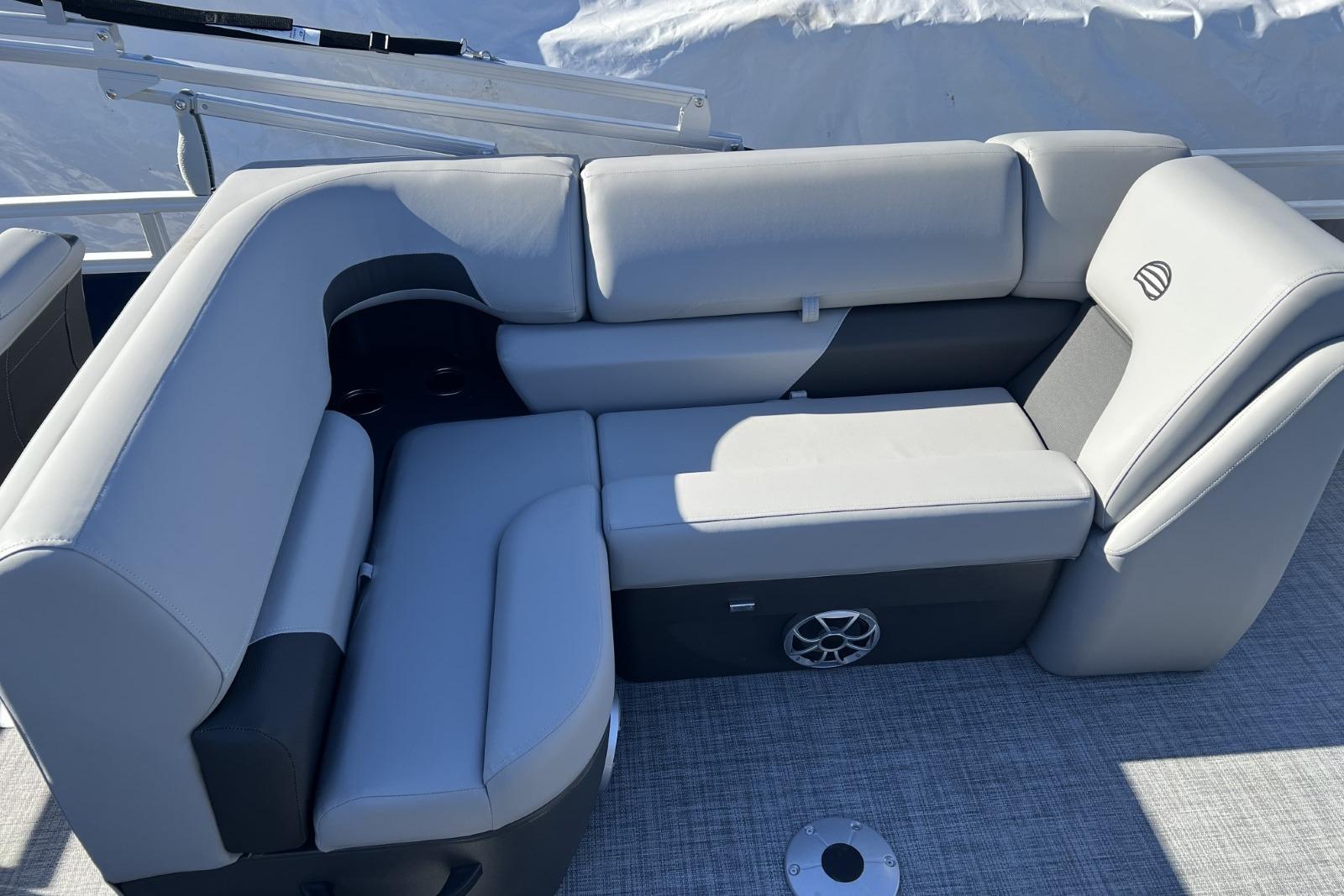 2026 Sun Tracker SportFish 22 DLX boat interior with gray cushioned seating.
