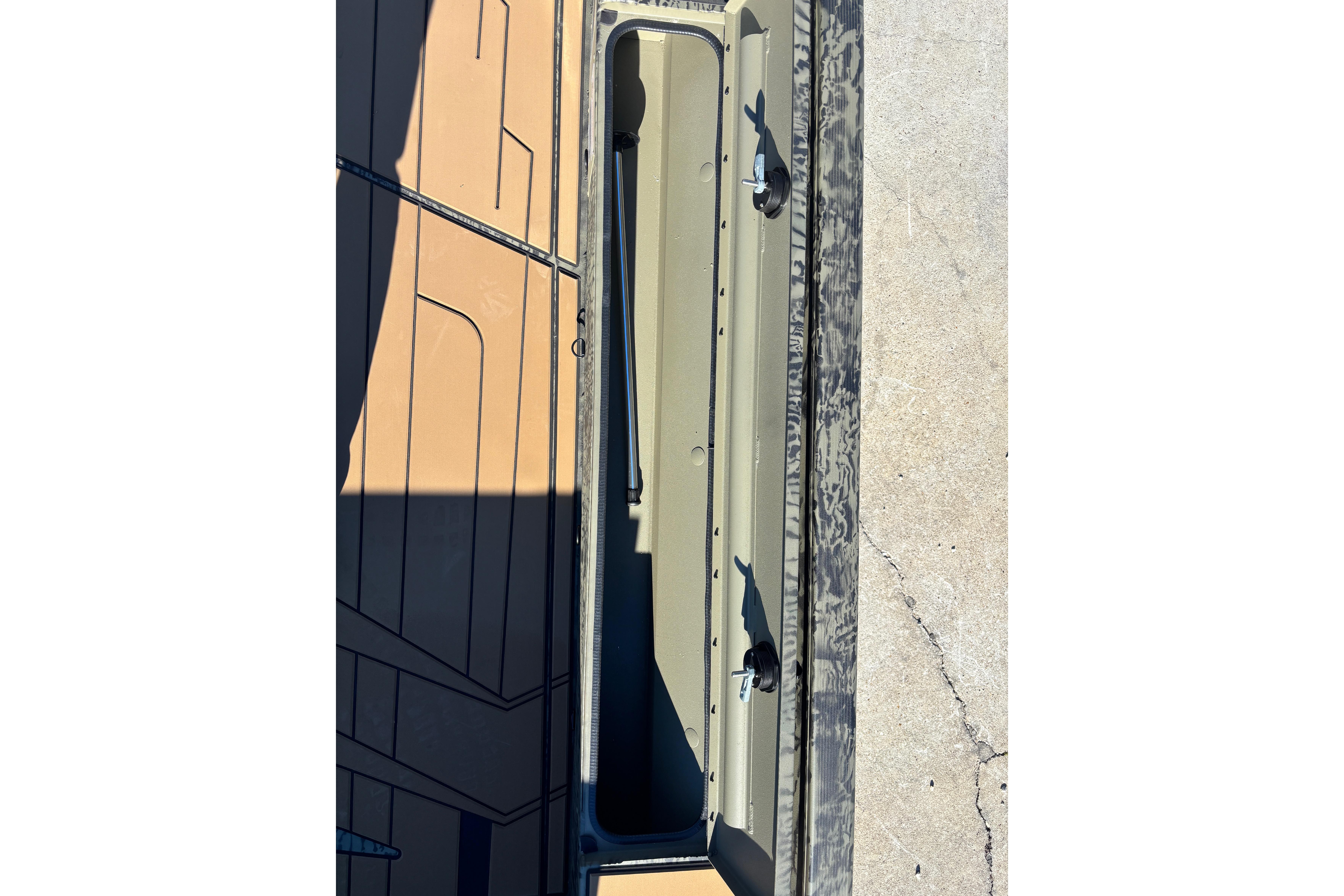 2026 Tracker Grizzly 1756 T Marsh boat interior storage compartment.