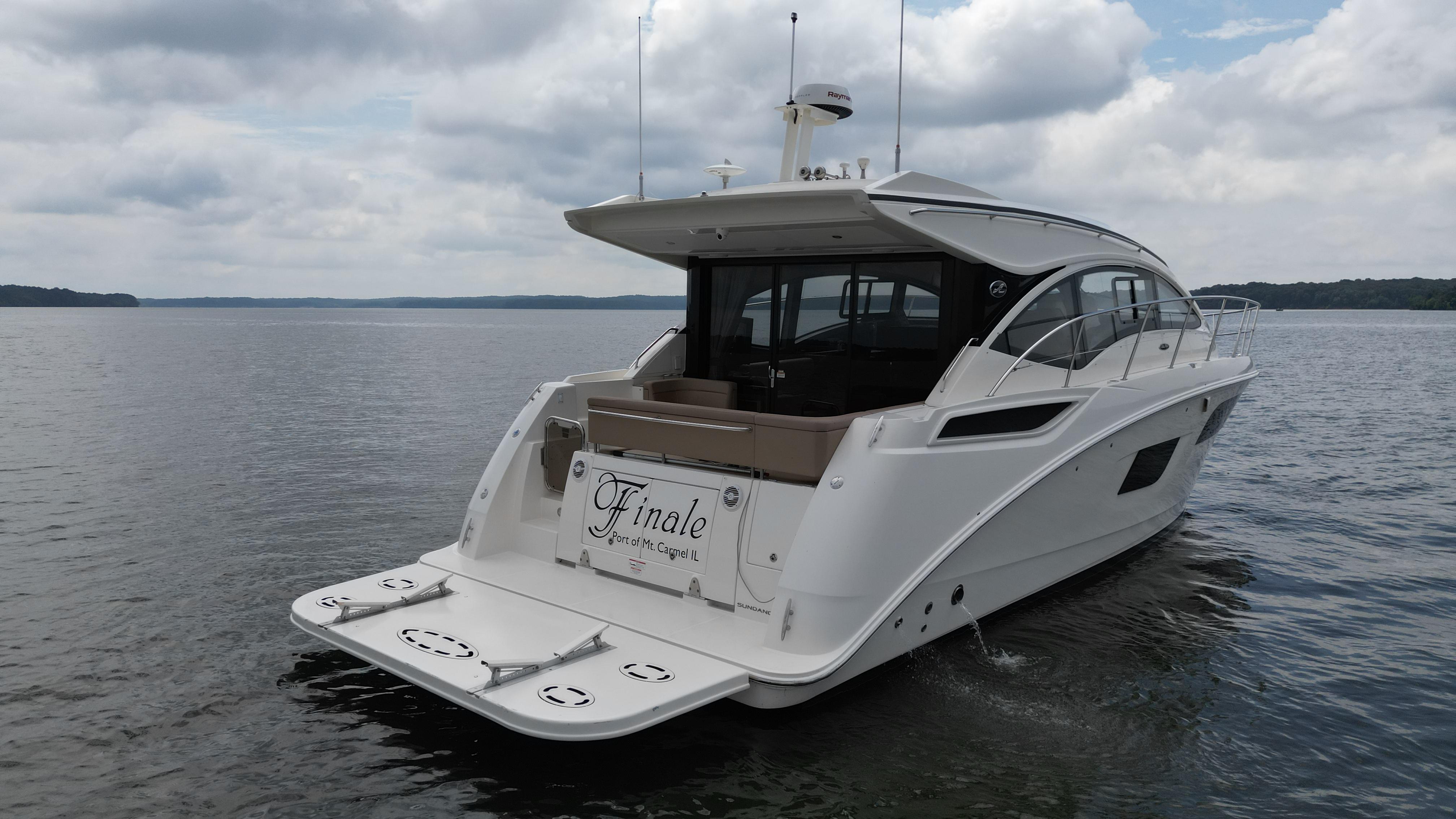 2017 Sea Ray Sundancer 400 yacht on calm waters under cloudy skies.