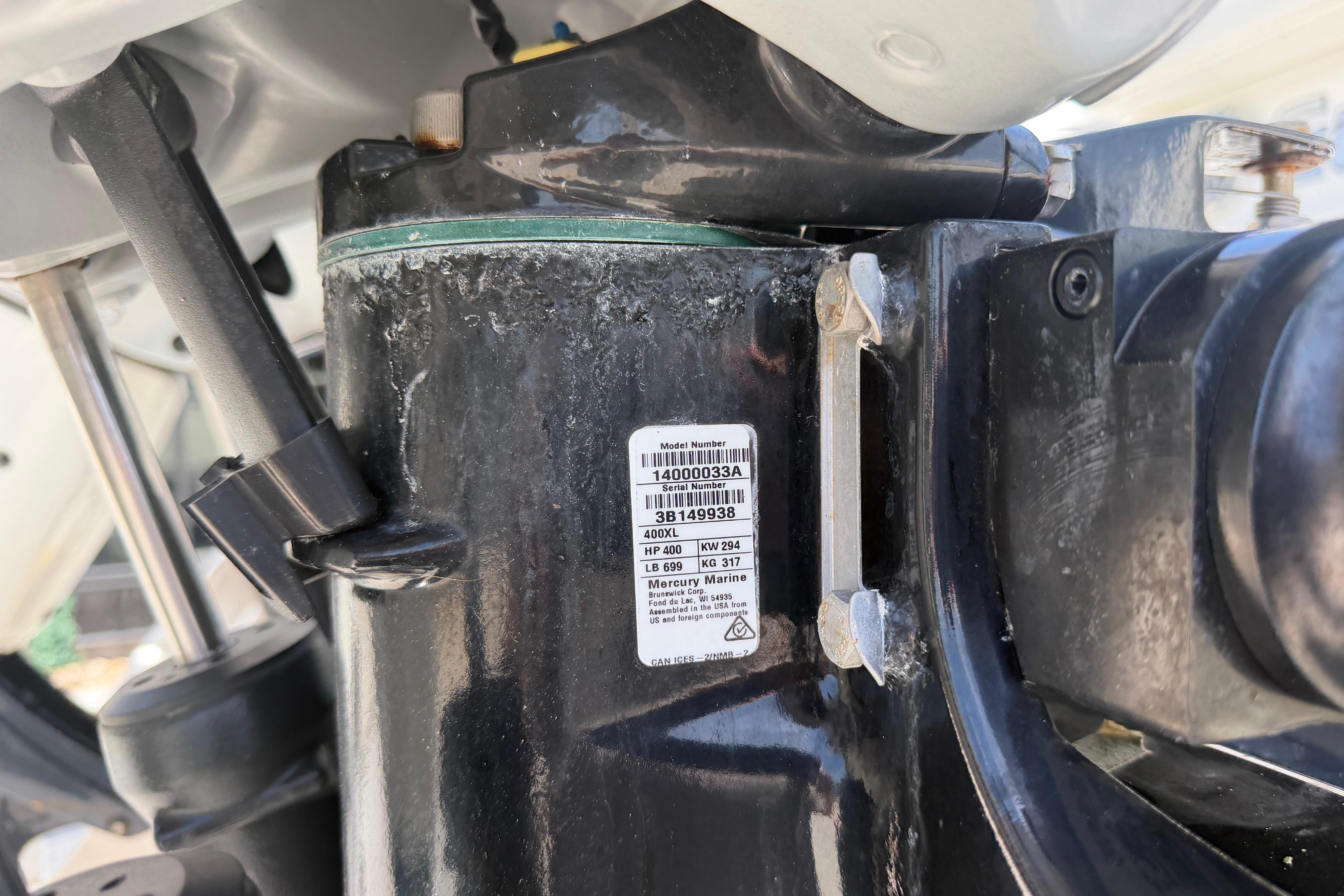 Close-up of a 2022 Formula 310 Sun Sport engine component with model number label.
