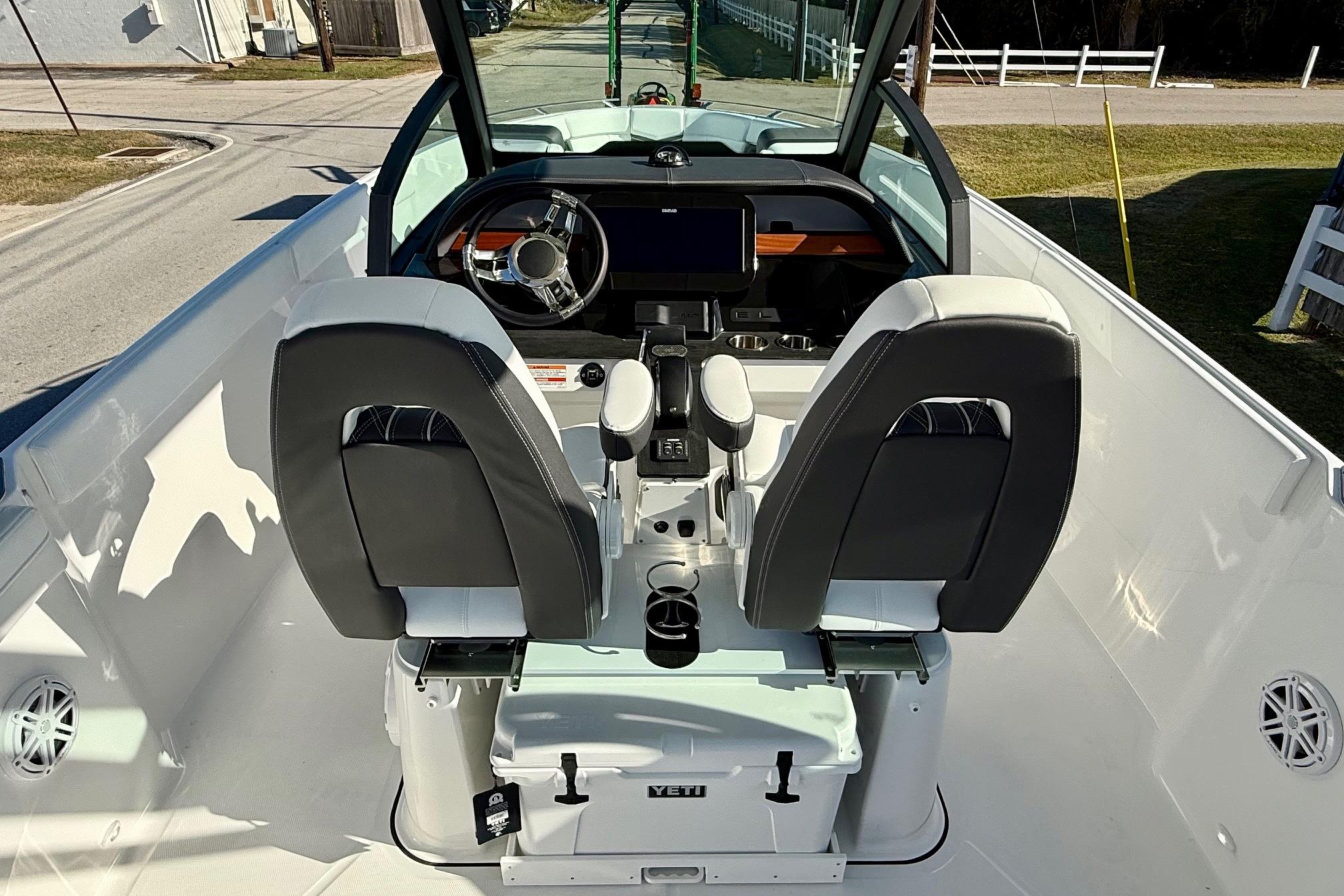 Interior of 2026 Monterey Elite 27 OB with modern helm console.