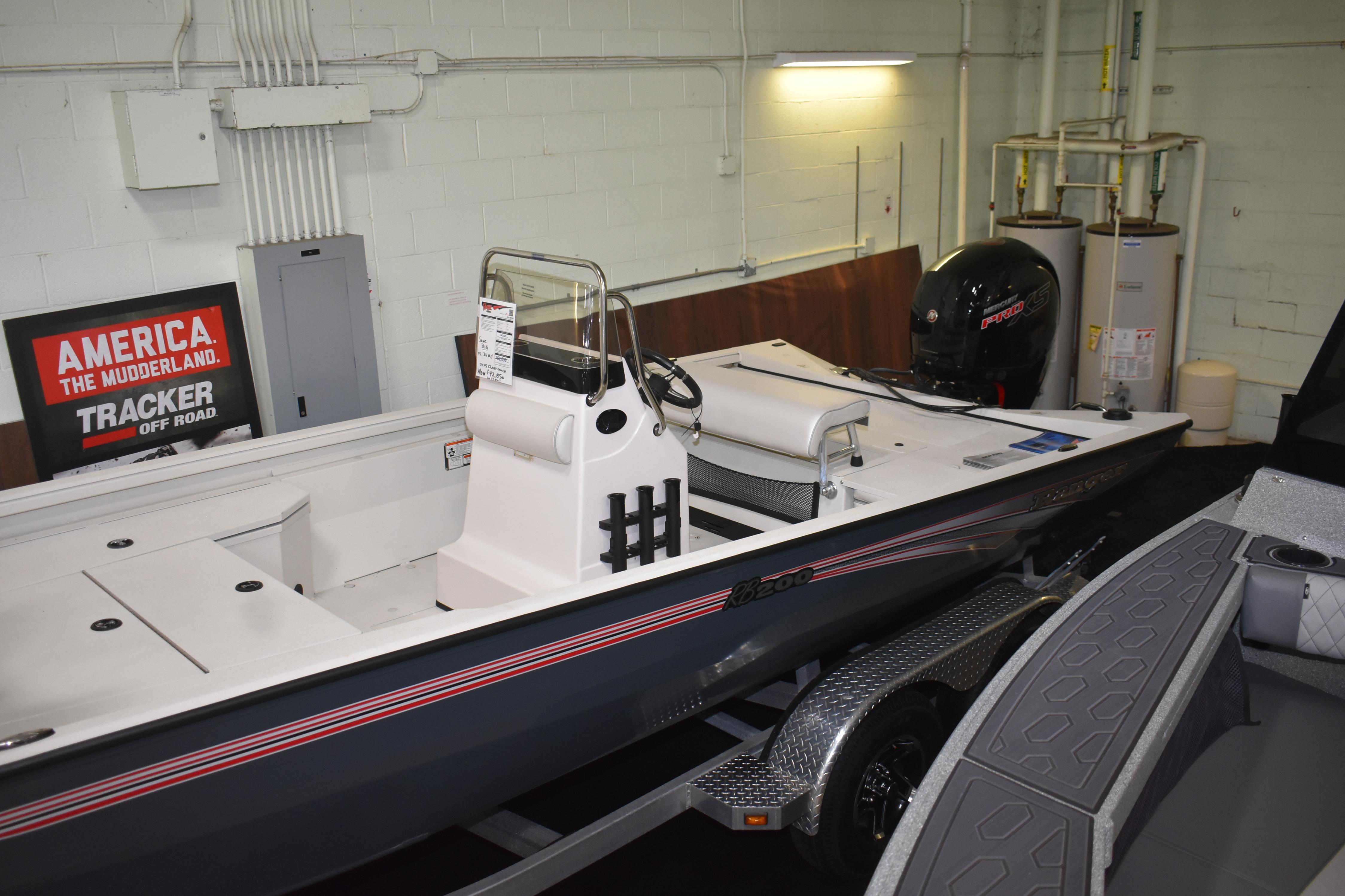 2024 Ranger RB200 boat in showroom, featuring sleek design and powerful engine.