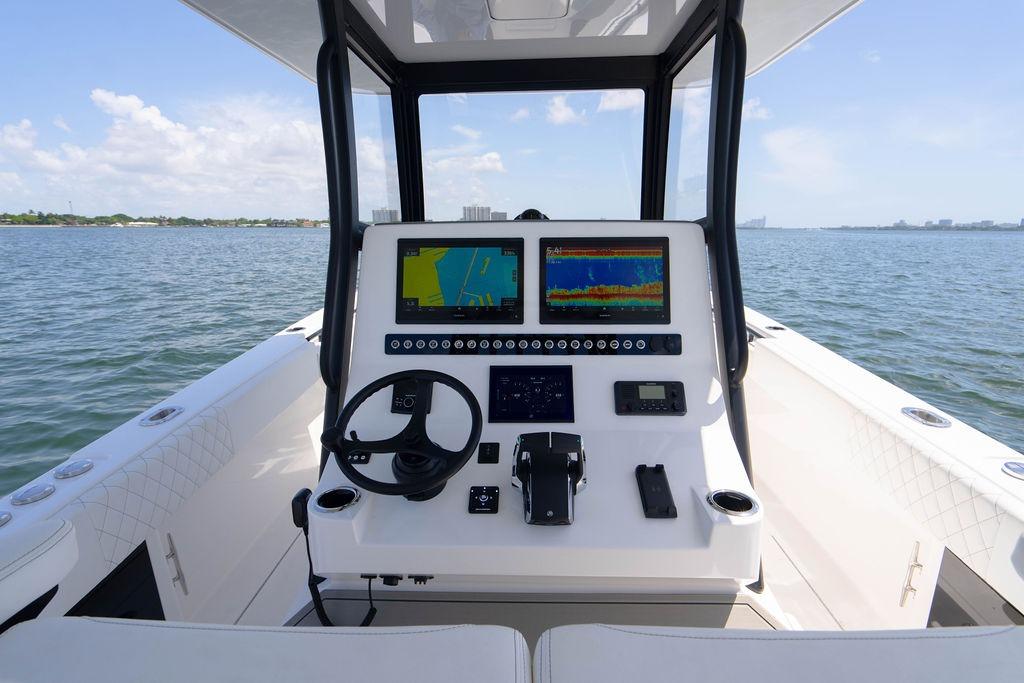 Cockpit view of 2027 Reef Runner 340 boat with advanced navigation displays.