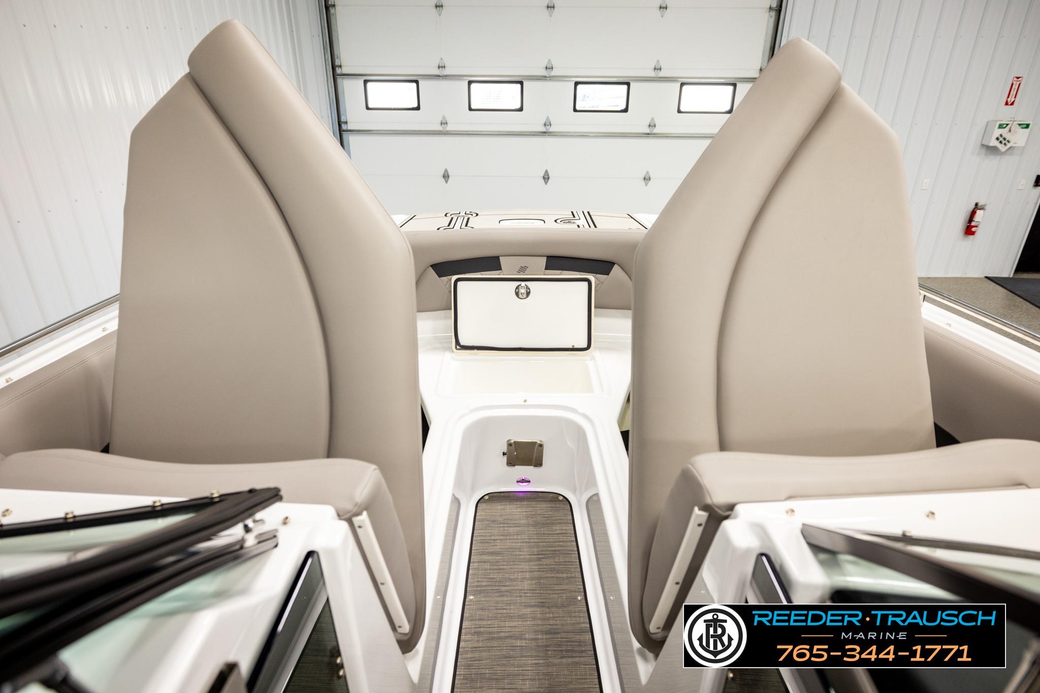 2024 FOURWINNS HD5 Surf boat interior with beige seating and modern design.